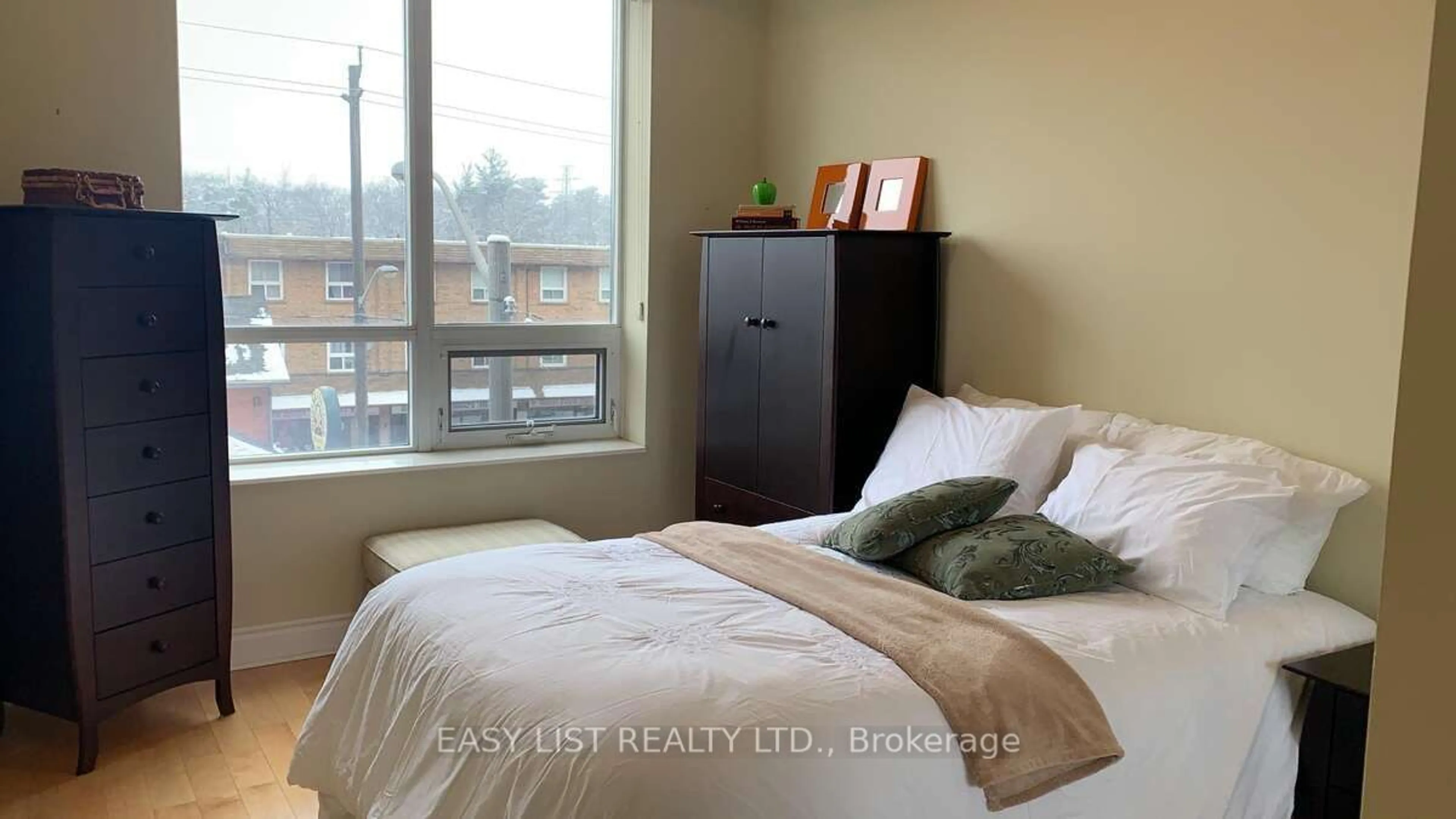 Bedroom with bed, wood/laminate floor for 25 Earlington Ave #309, Toronto Ontario M8X 3A3