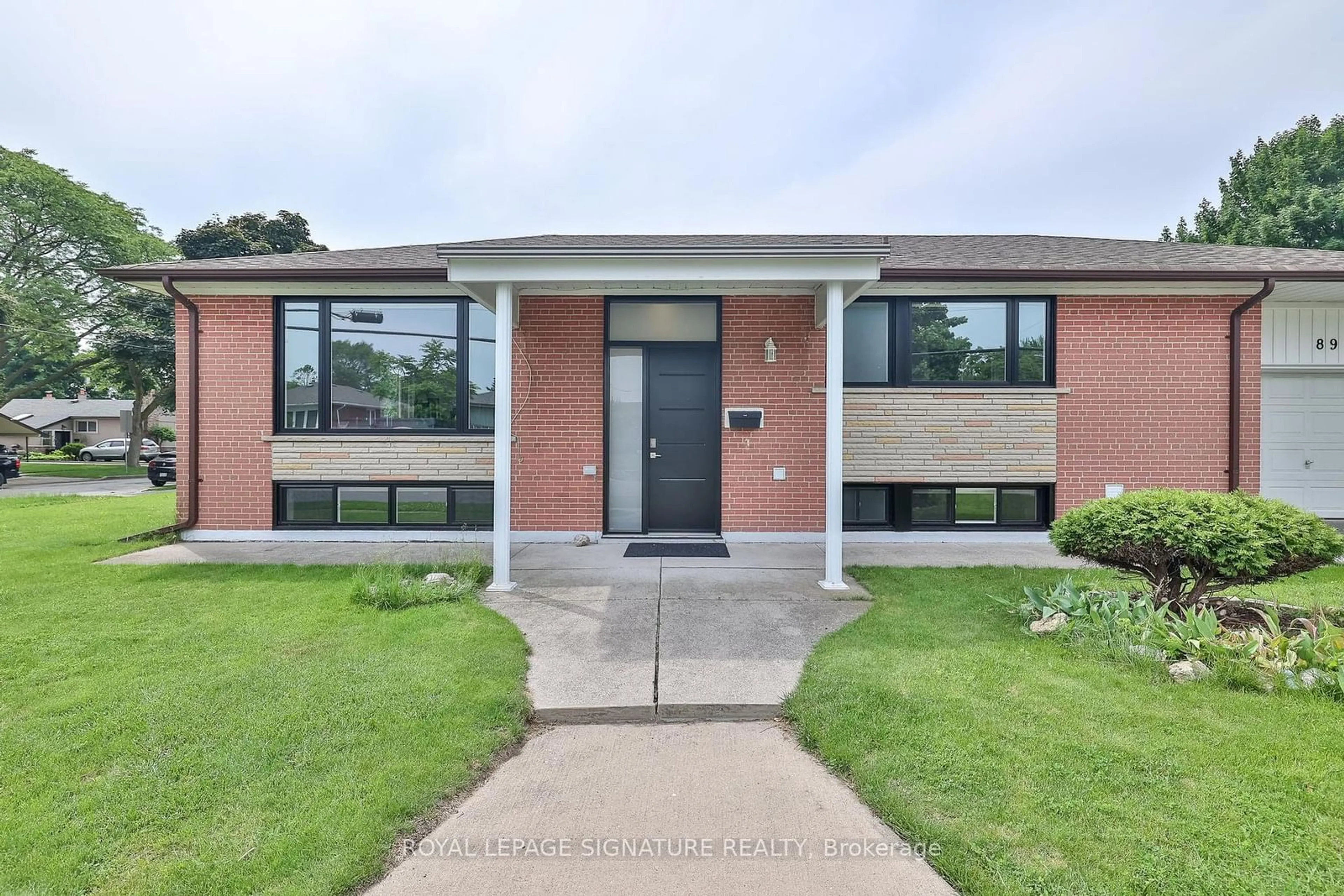 Home with brick exterior material, street for 89 Thistle Down Blvd, Toronto Ontario M9V 1J3