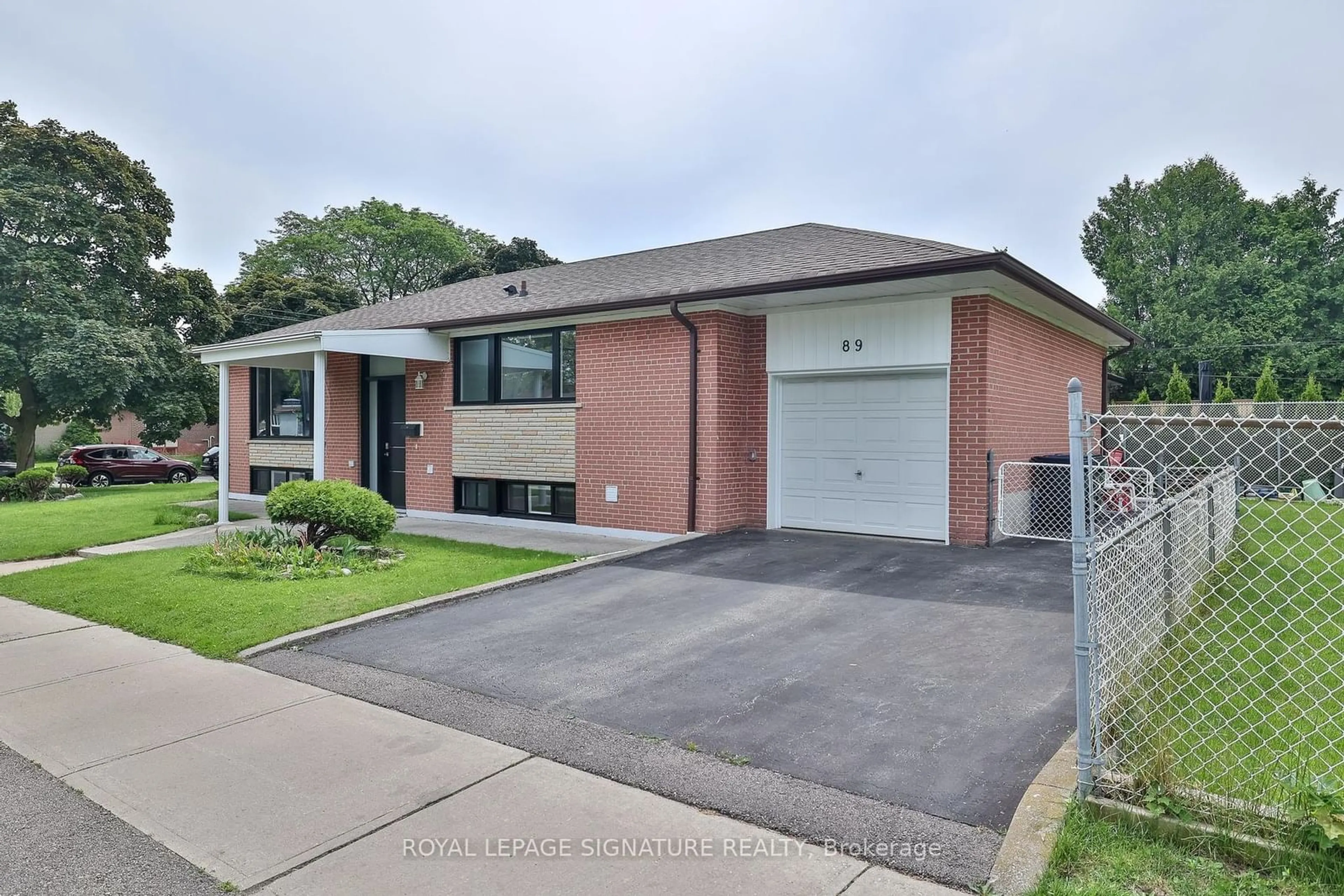 Home with brick exterior material, street for 89 Thistle Down Blvd, Toronto Ontario M9V 1J3