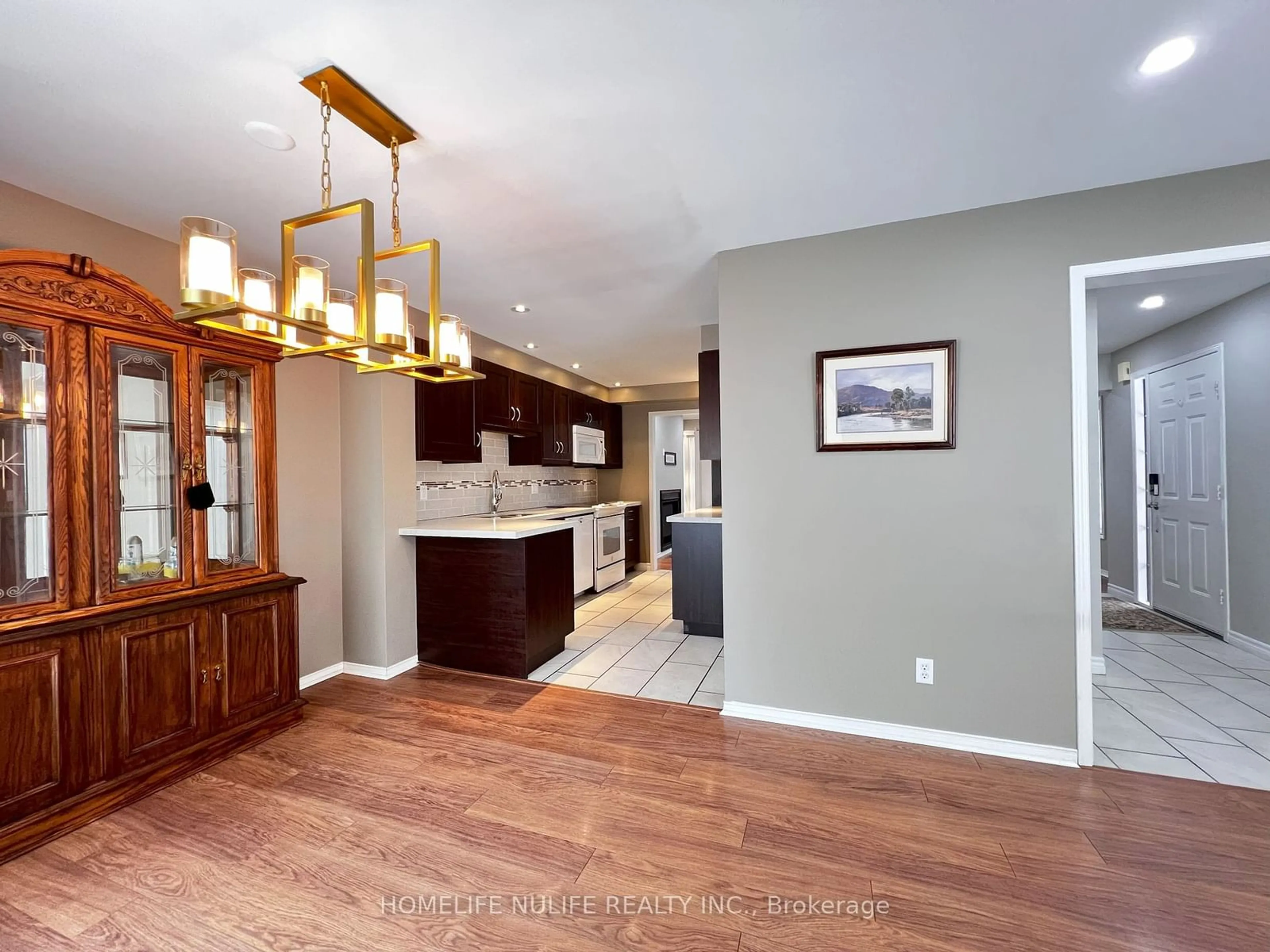 Open concept kitchen, wood/laminate floor for 6578 Lisgar Dr, Mississauga Ontario L5N 6W1