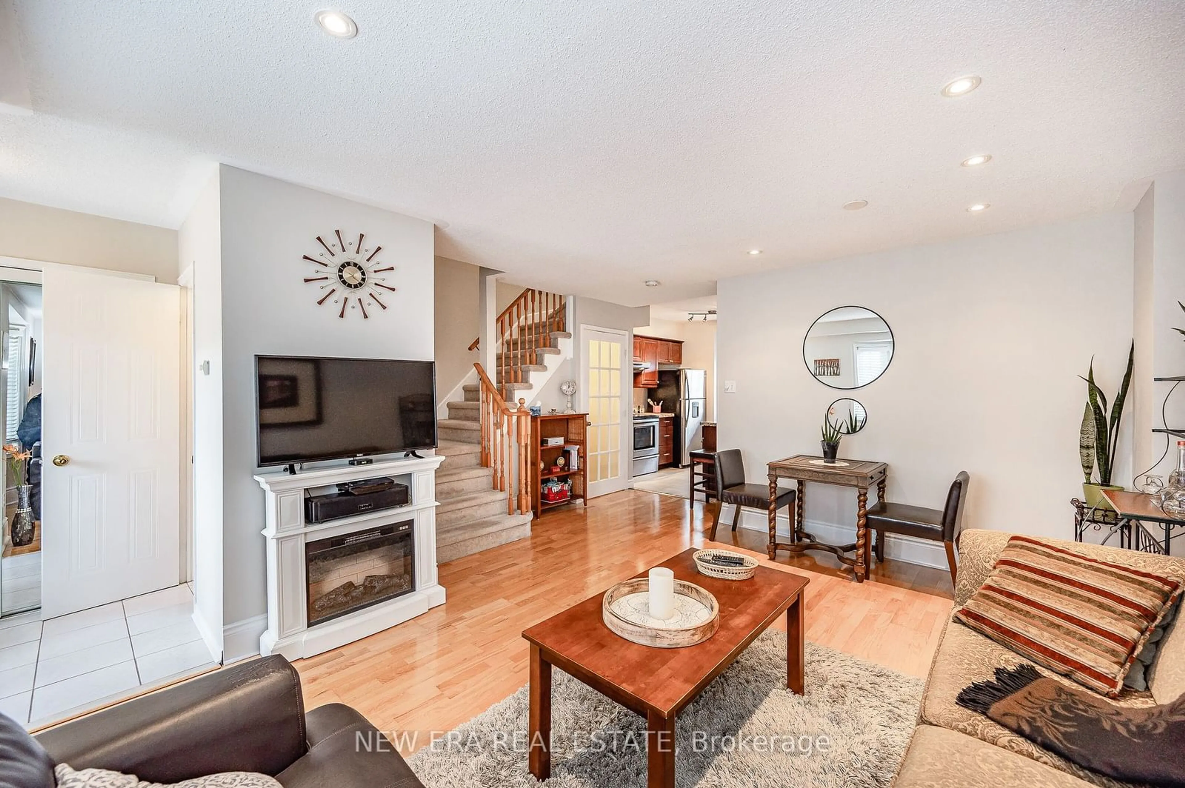 Living room with furniture, wood/laminate floor for 102 Glenashton Dr, Oakville Ontario L6H 6G3