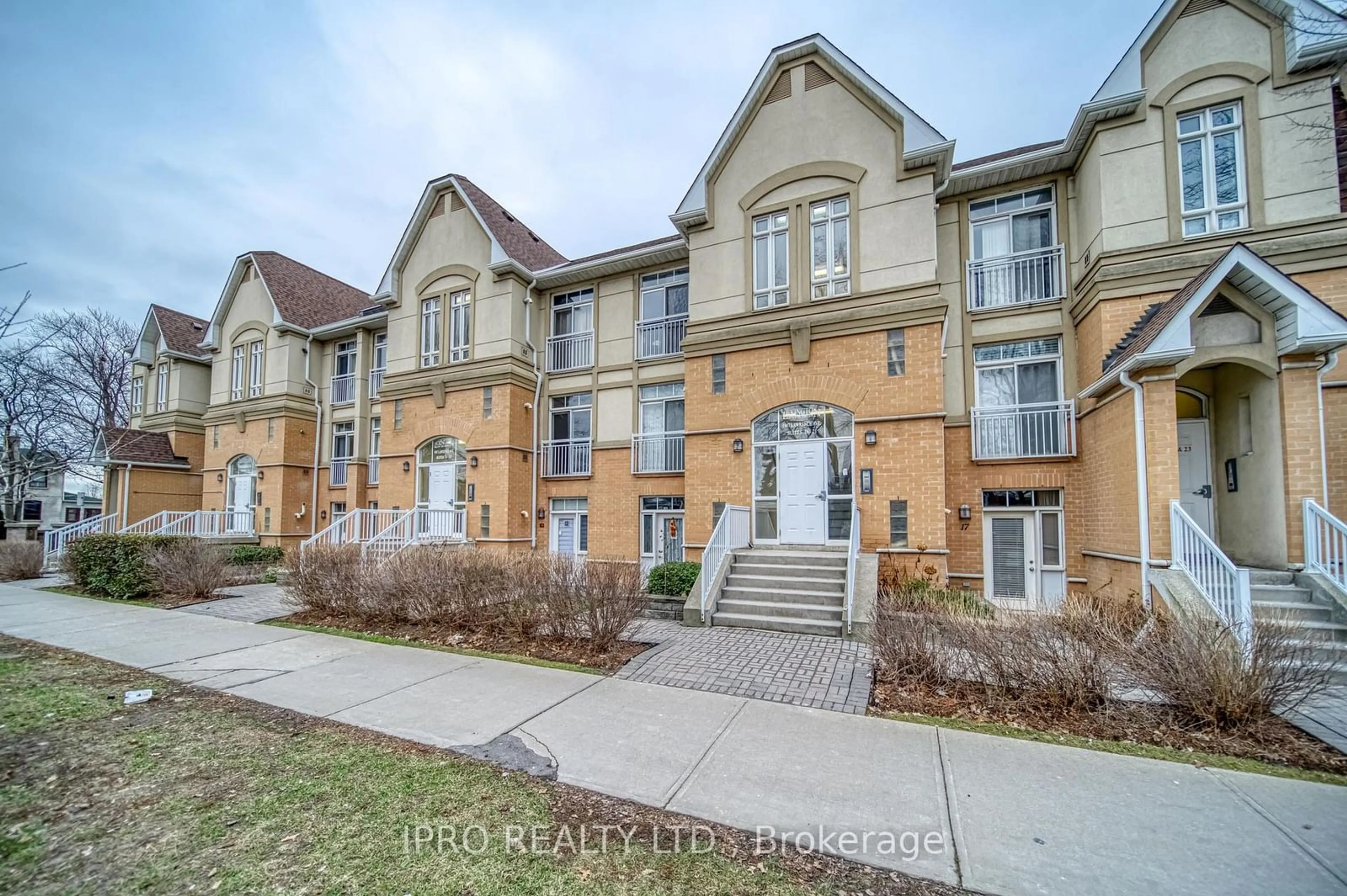 A pic from outside/outdoor area/front of a property/back of a property/a pic from drone, street for 1947 Lawrence Ave ##2, Toronto Ontario M9N 1H3