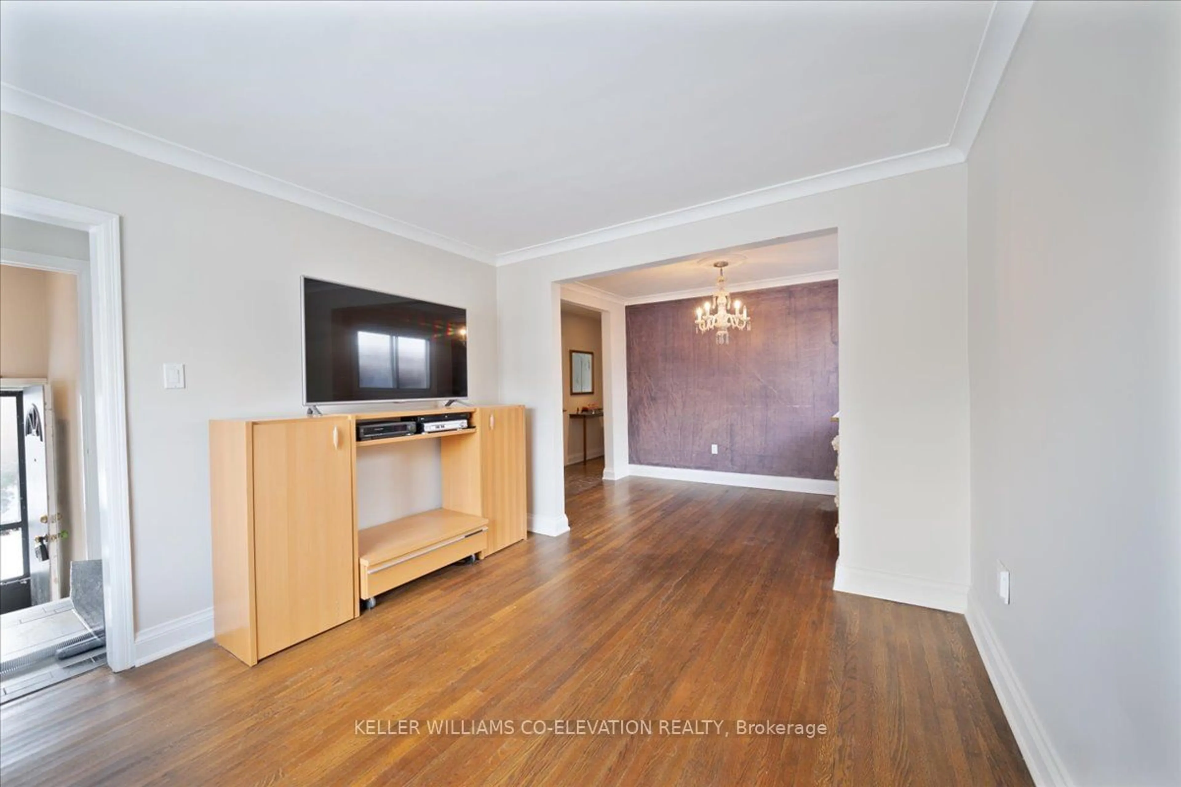 Living room with furniture, wood/laminate floor for 56 Glenhaven St, Toronto Ontario M6M 3M3