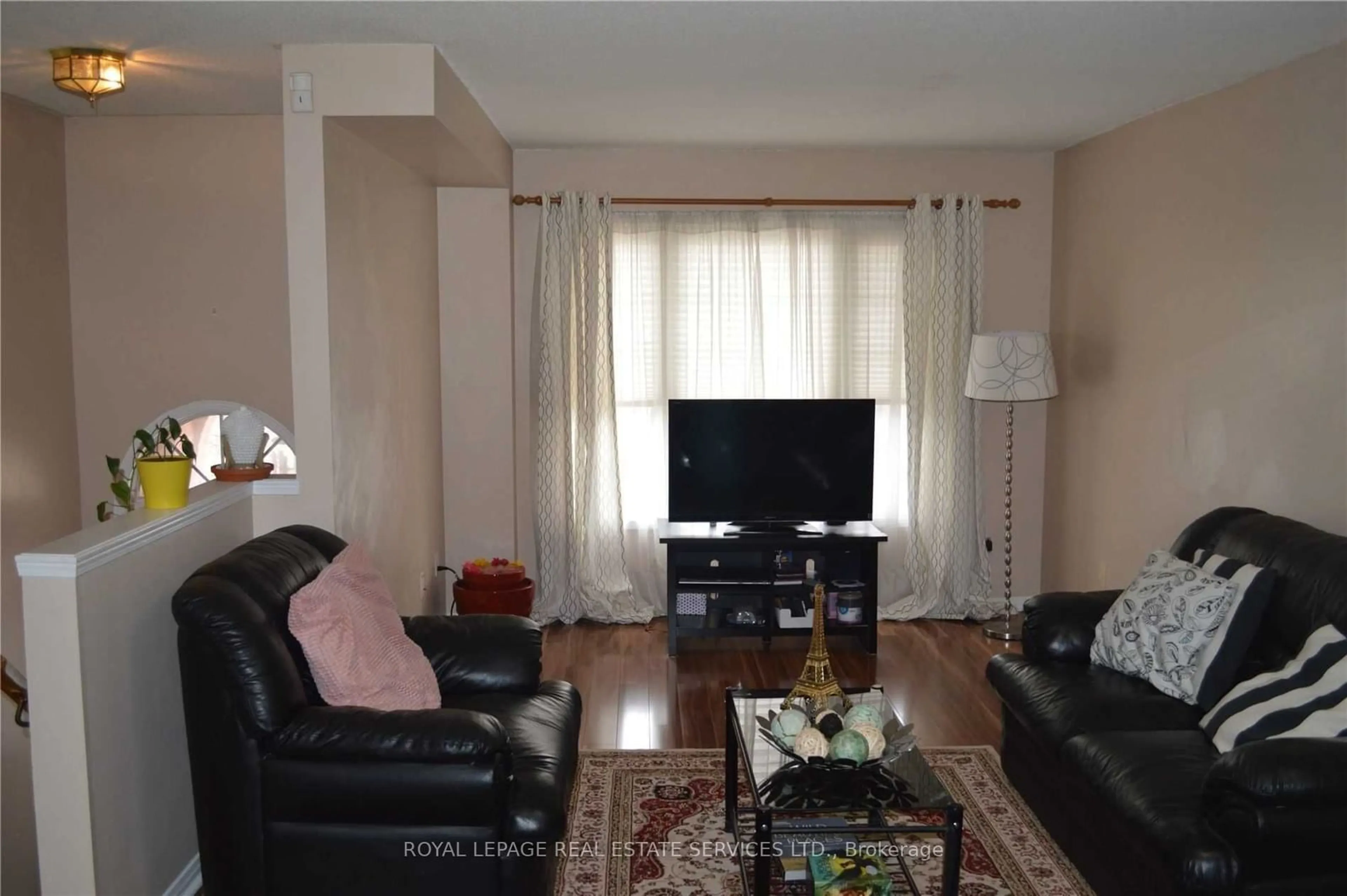 Living room with furniture, wood/laminate floor for 5030 Heatherleigh Ave #83, Mississauga Ontario L5V 2G7