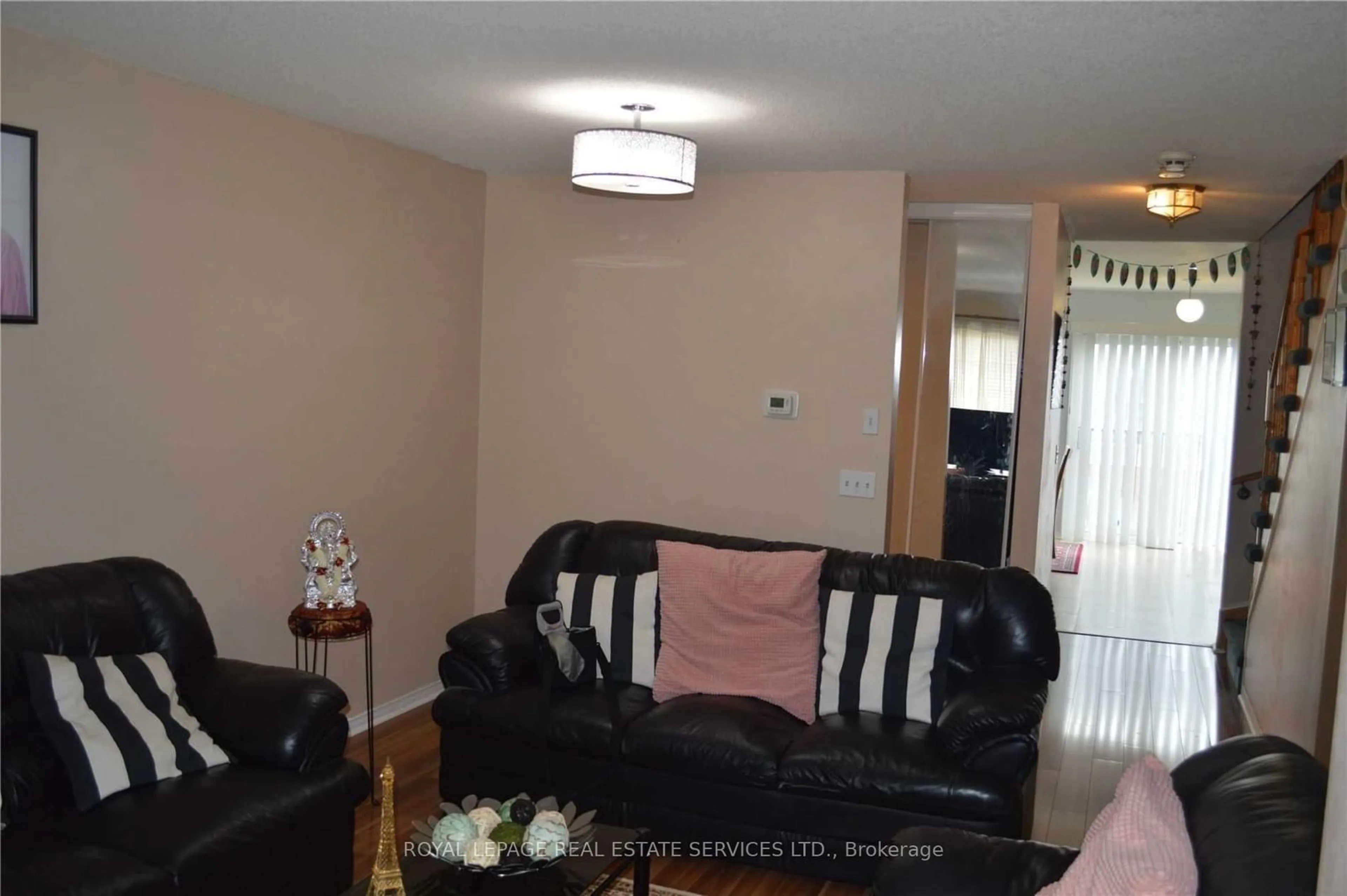 Living room with furniture, wood/laminate floor for 5030 Heatherleigh Ave #83, Mississauga Ontario L5V 2G7