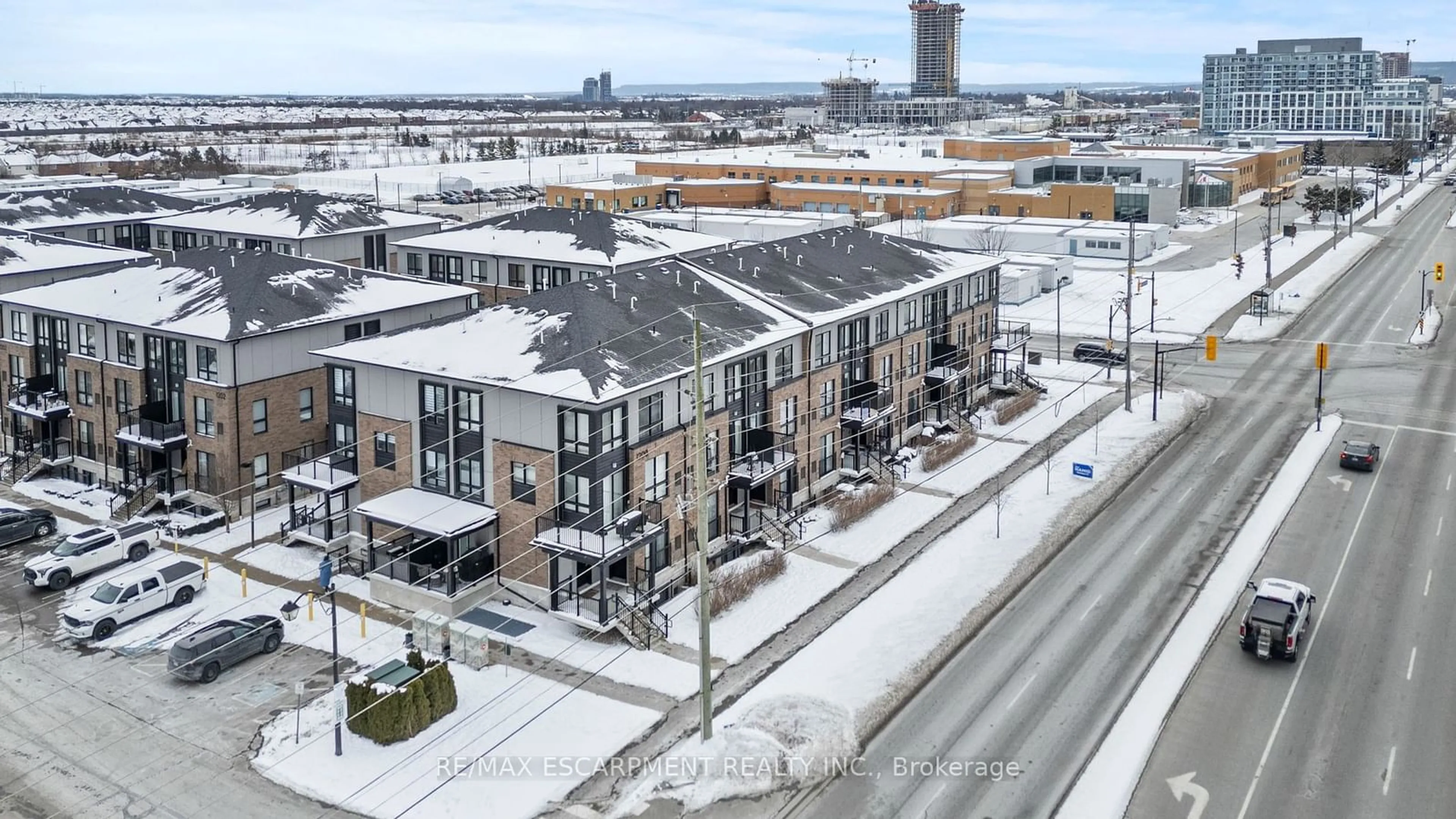 A pic from outside/outdoor area/front of a property/back of a property/a pic from drone, city buildings view from balcony for 1200 Main St #102, Milton Ontario L9T 8M7