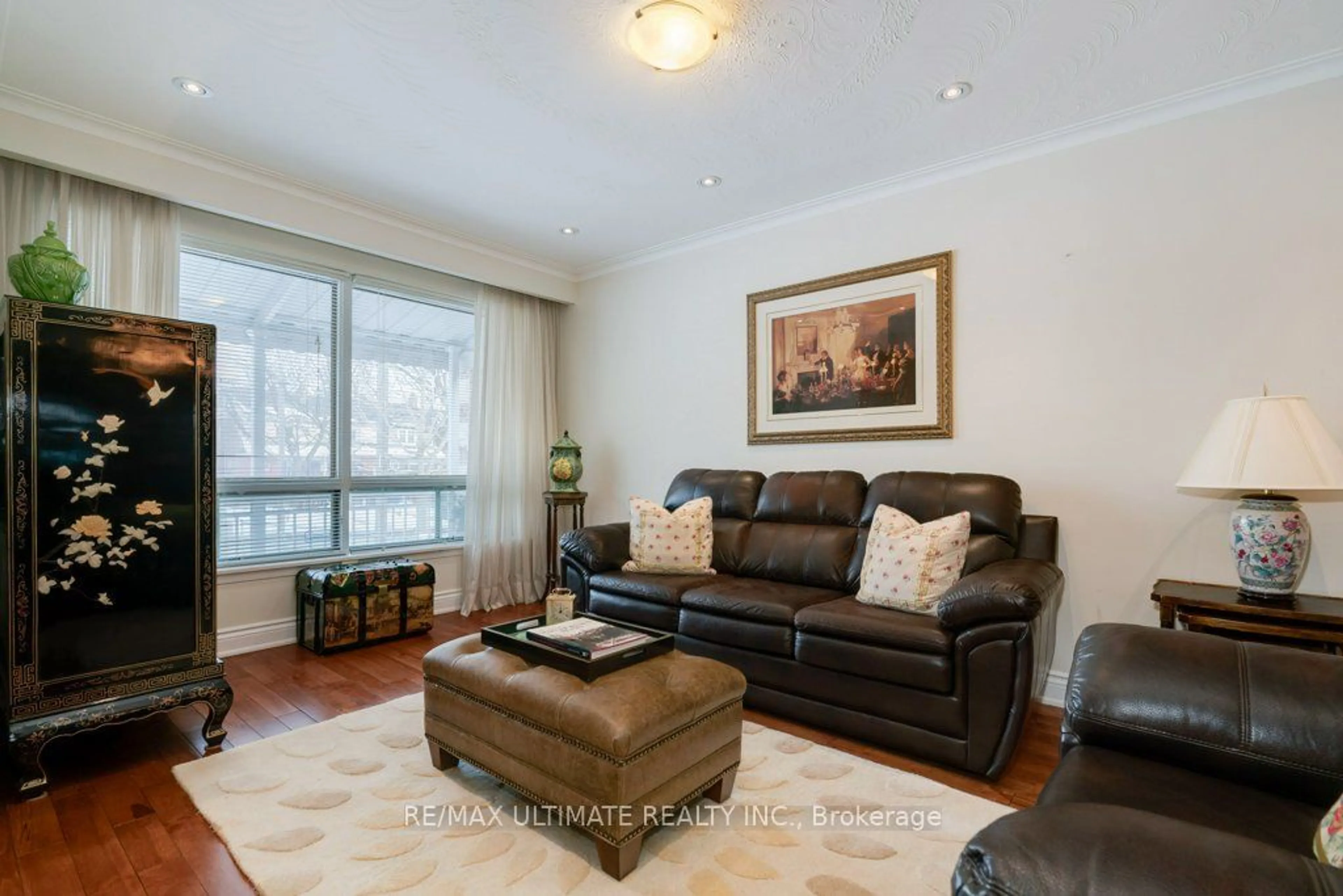 Living room with furniture, wood/laminate floor for 68 Caledonia Rd, Toronto Ontario M6E 4S6