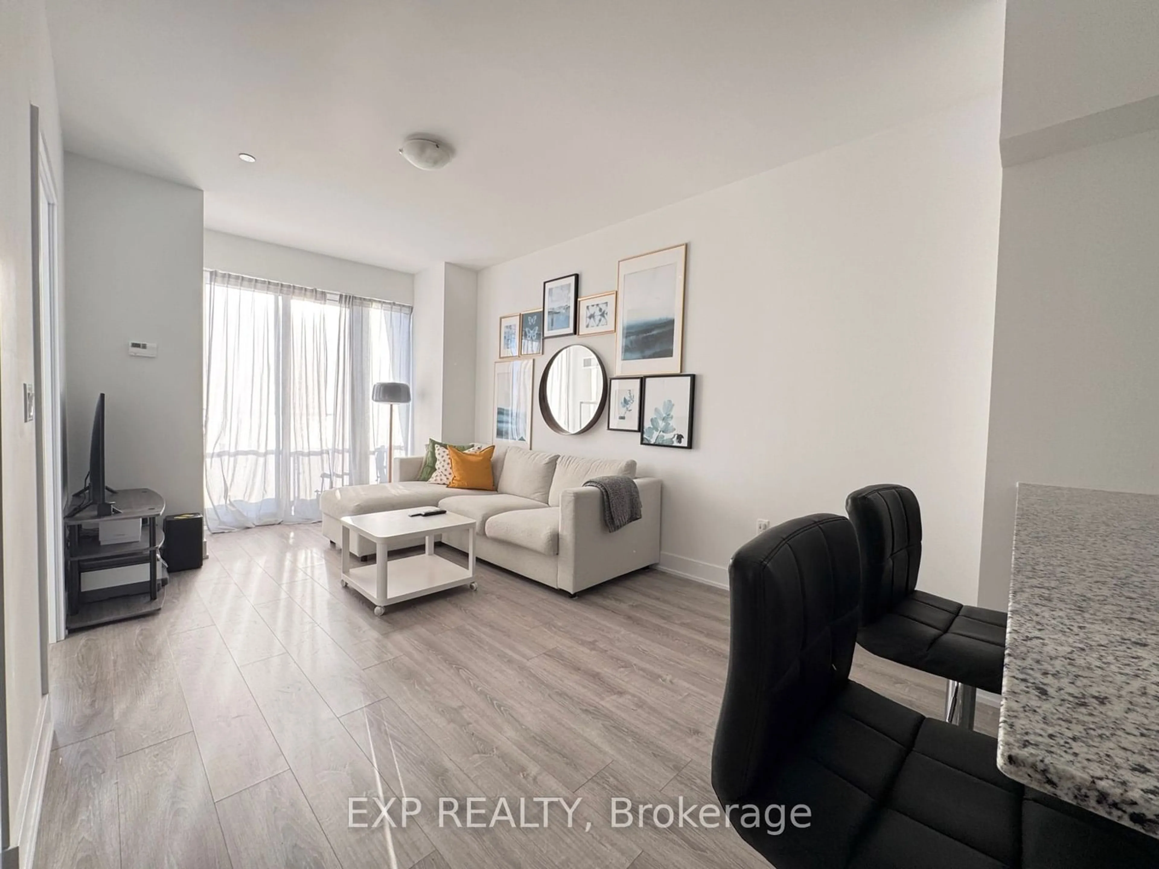 Living room with furniture, wood/laminate floor for 20 Shore Breeze Dr #2808, Toronto Ontario M8V 0C7