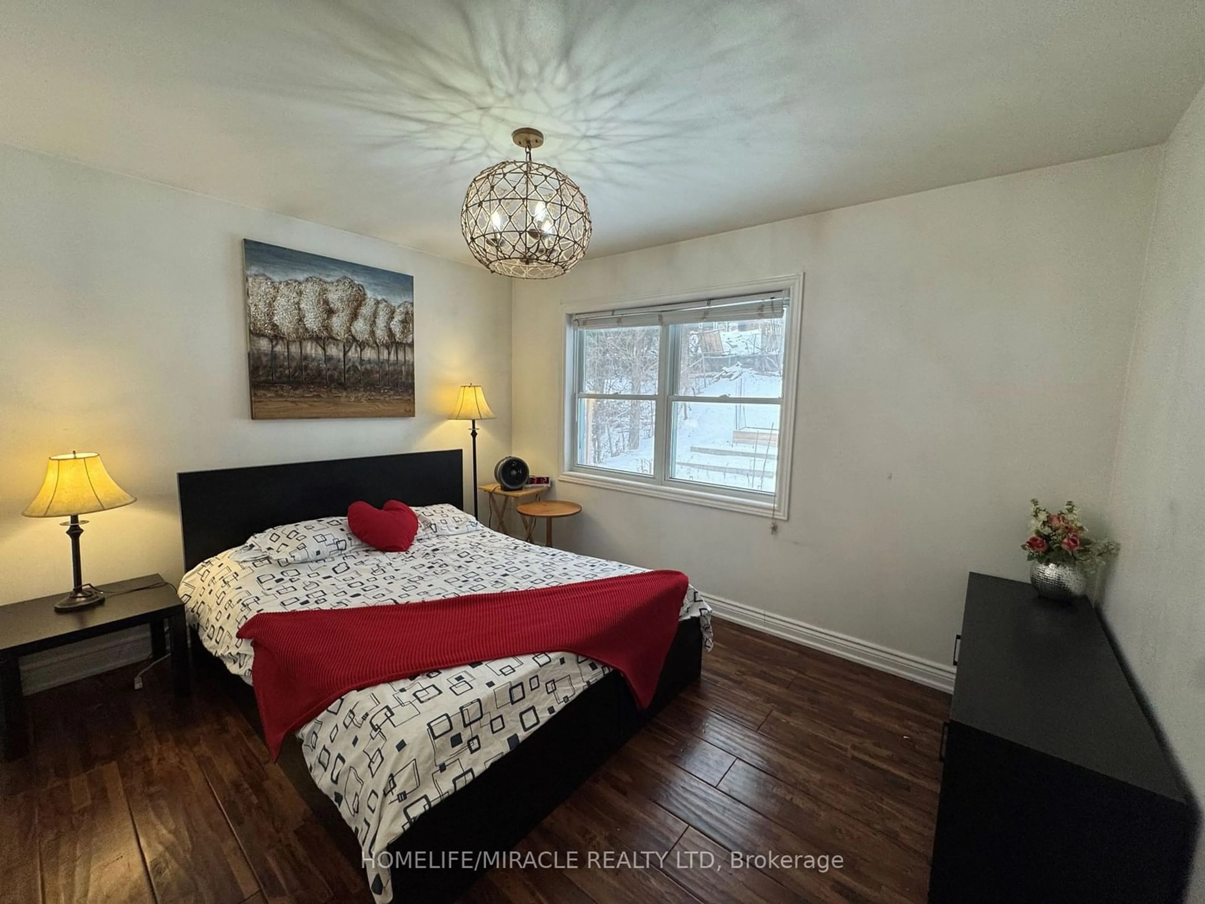 Bedroom with bed, wood/laminate floor for 37 Meadowland Dr, Brampton Ontario L6W 2R5