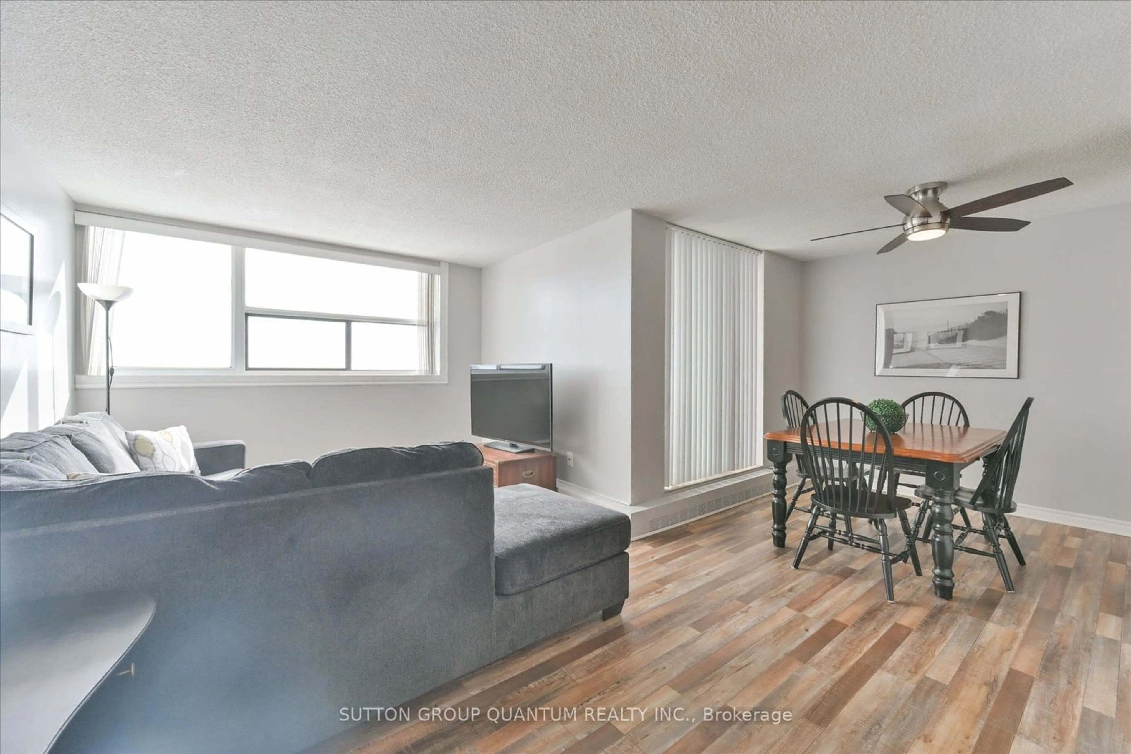 Living room with furniture, wood/laminate floor for 2900 Battleford Rd #1608, Mississauga Ontario L5N 2V9