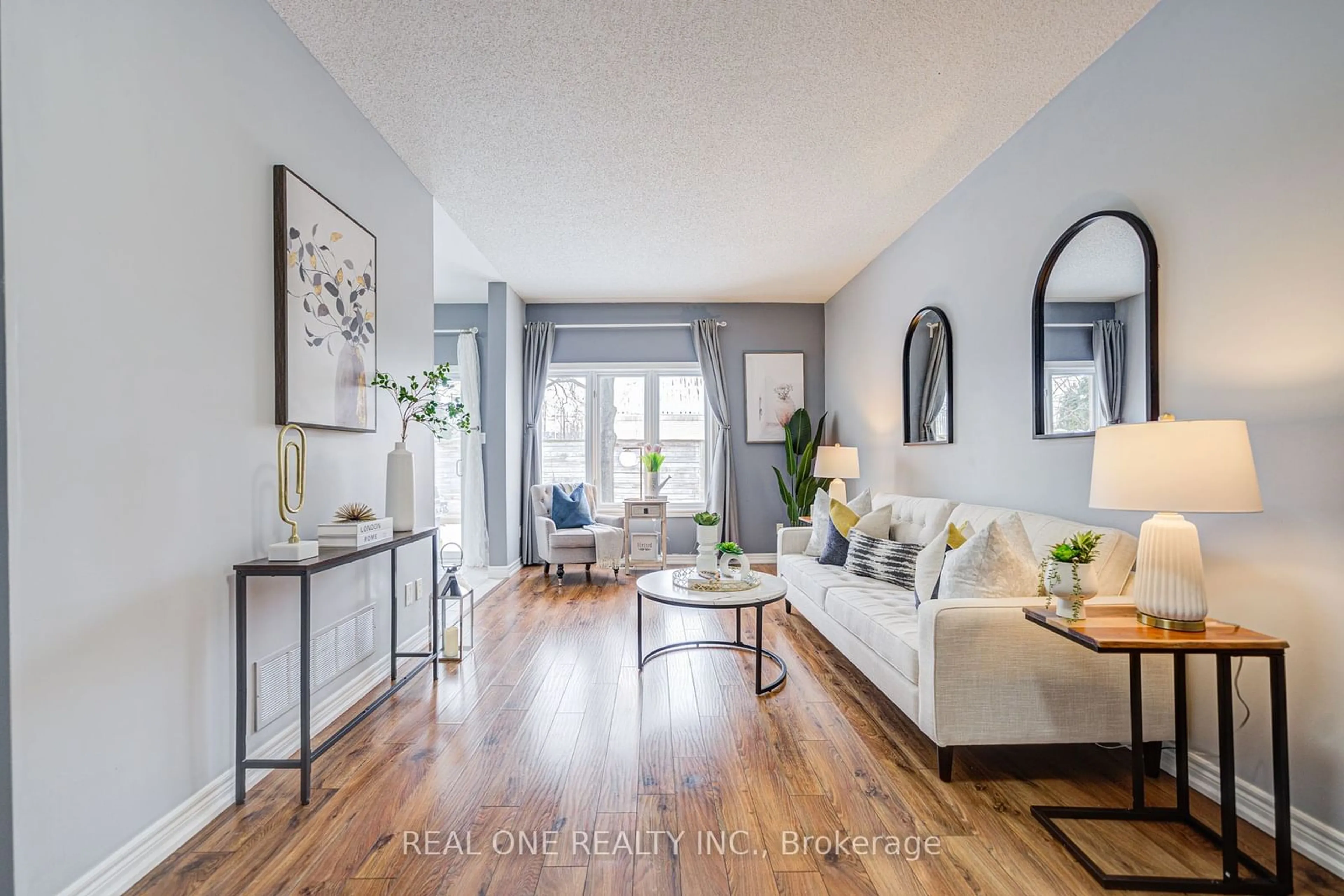 Living room with furniture, wood/laminate floor for 963 KING Rd #25, Burlington Ontario L7T 3L2