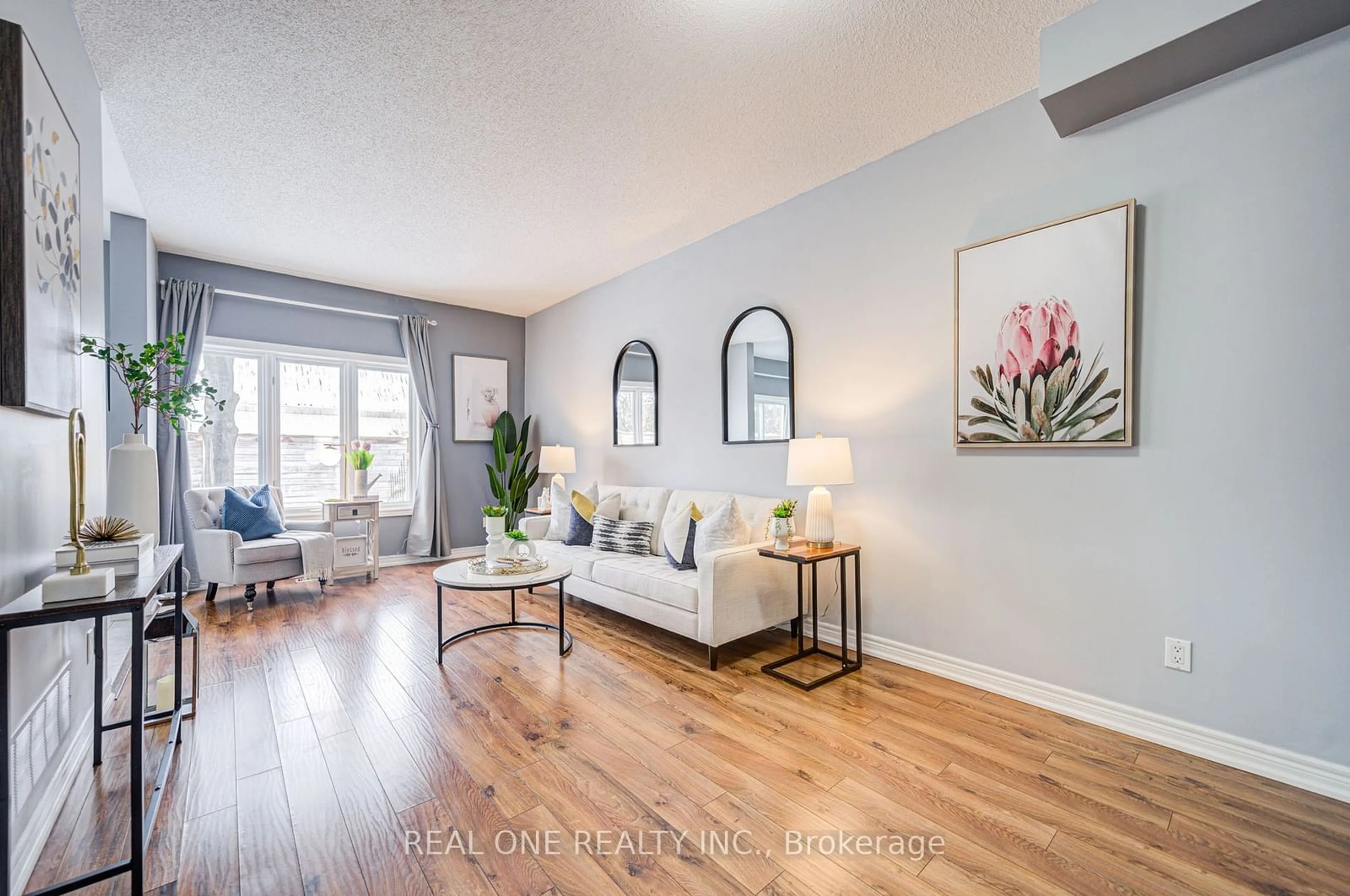 Living room with furniture, wood/laminate floor for 963 KING Rd #25, Burlington Ontario L7T 3L2