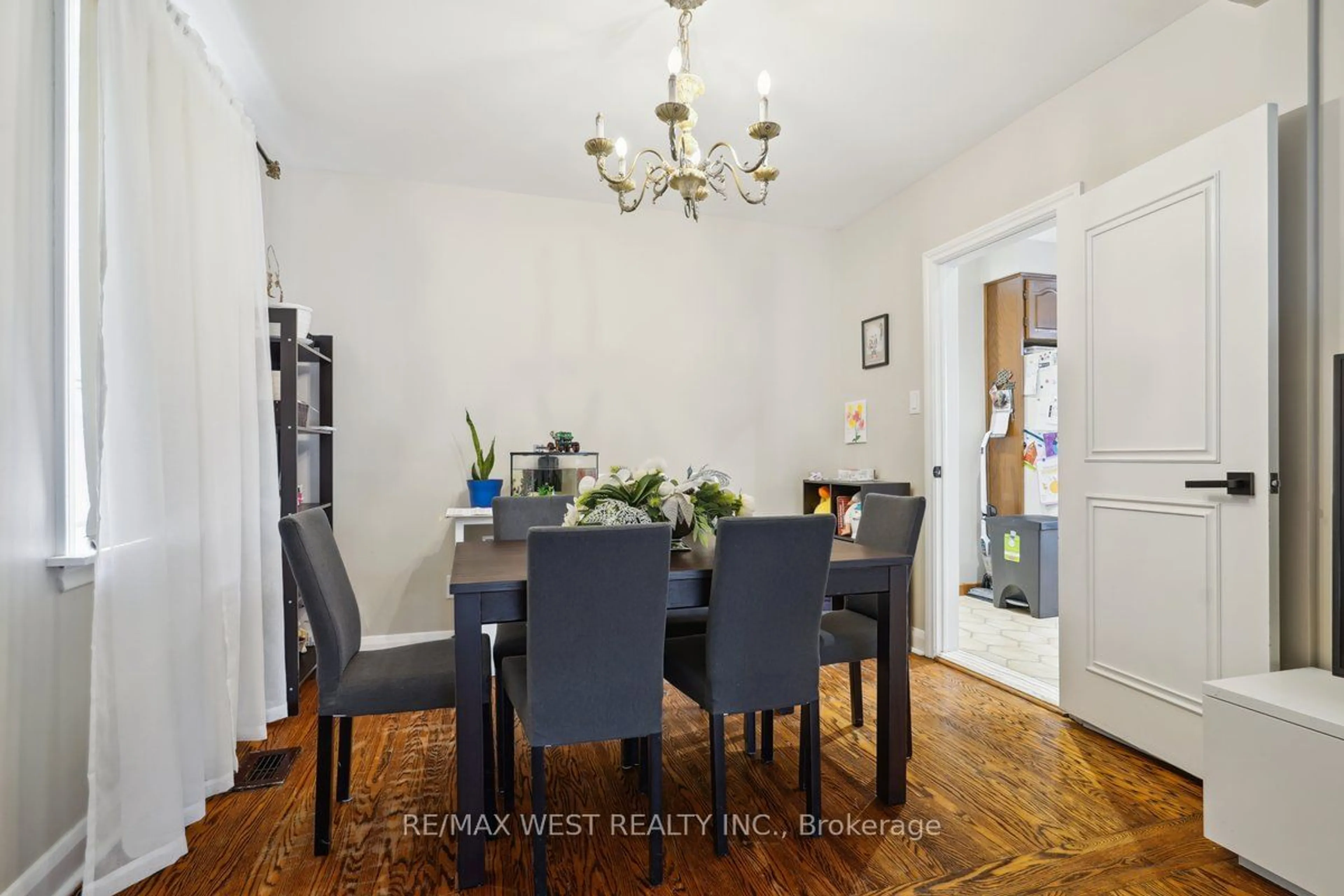 Dining room, wood/laminate floor for 555 Silverthorn Ave, Toronto Ontario M6M 3J1