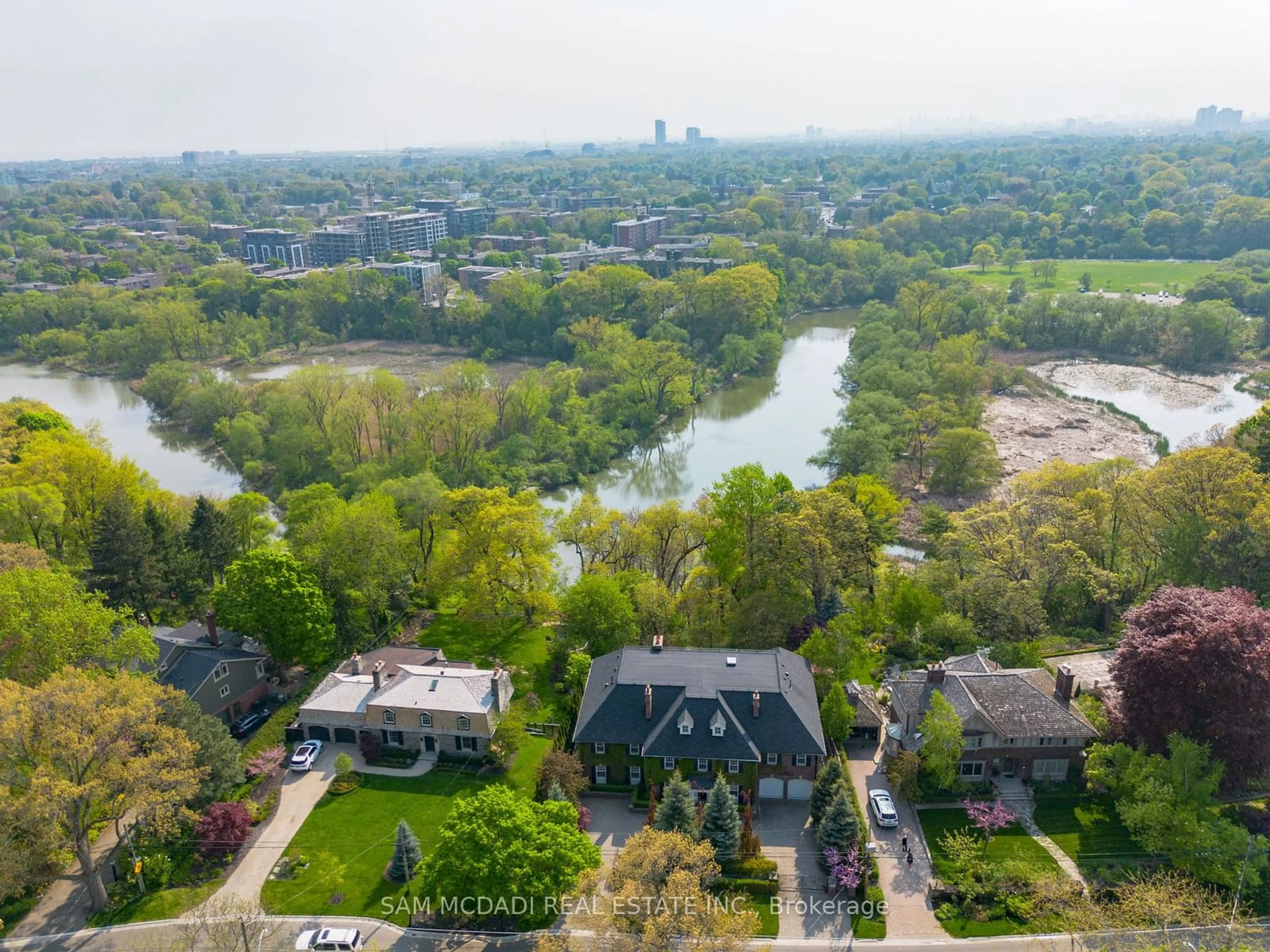 A pic from outside/outdoor area/front of a property/back of a property/a pic from drone, water/lake/river/ocean view for 246 Riverside Dr, Toronto Ontario M6S 4A9