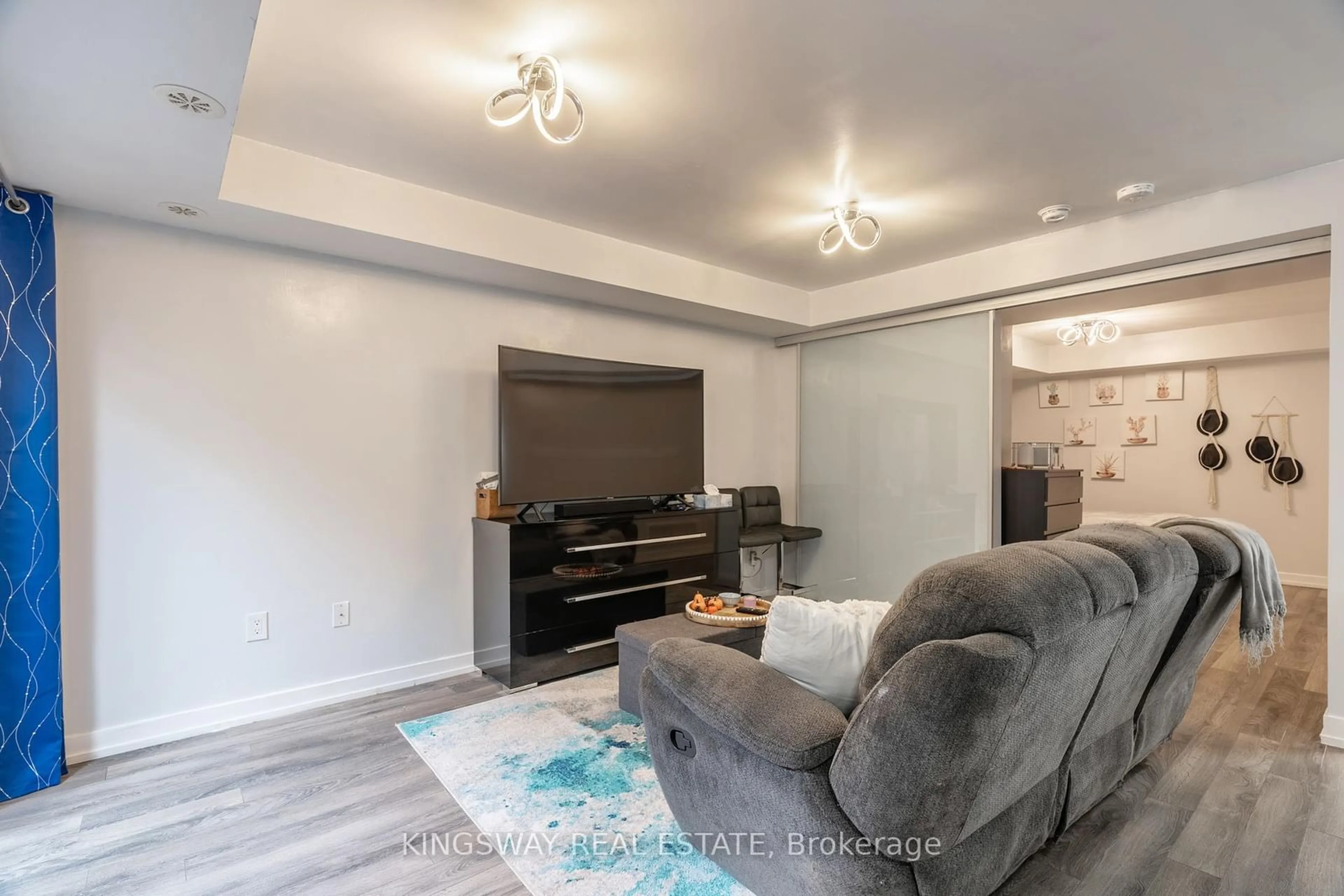 Living room with furniture, wood/laminate floor for 2315 Sheppard Ave #45, Toronto Ontario M9M 3A4