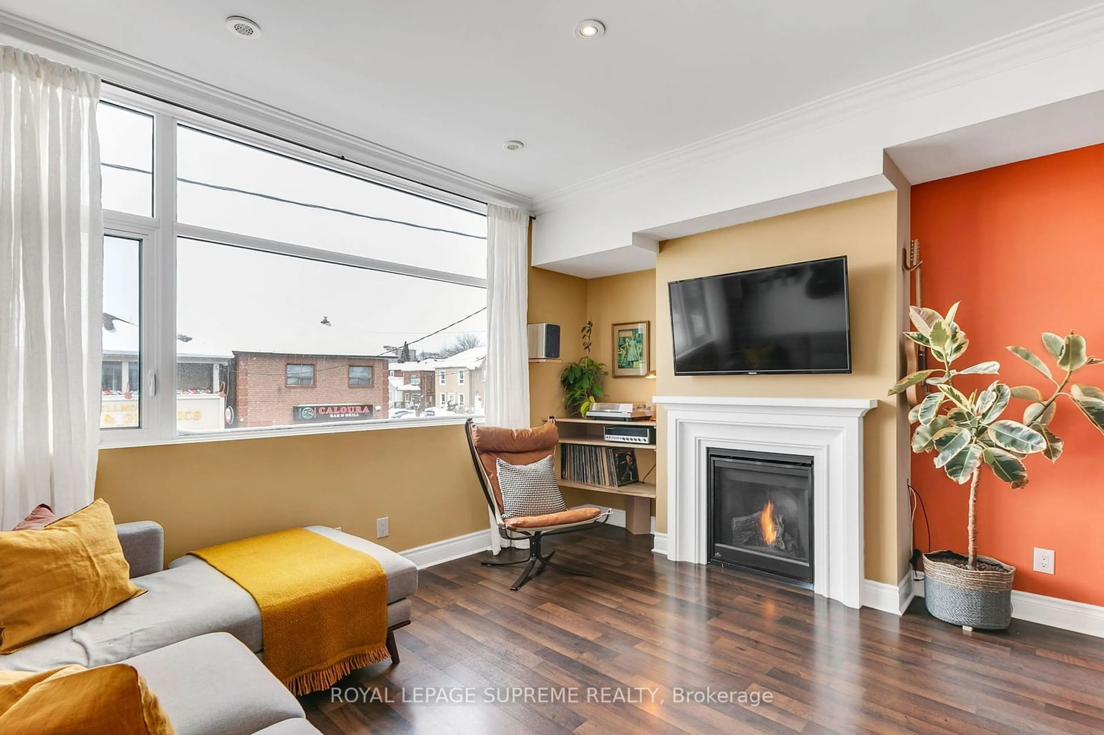 Living room with furniture, wood/laminate floor for 475 Rogers Rd #B, Toronto Ontario M6M 1B2