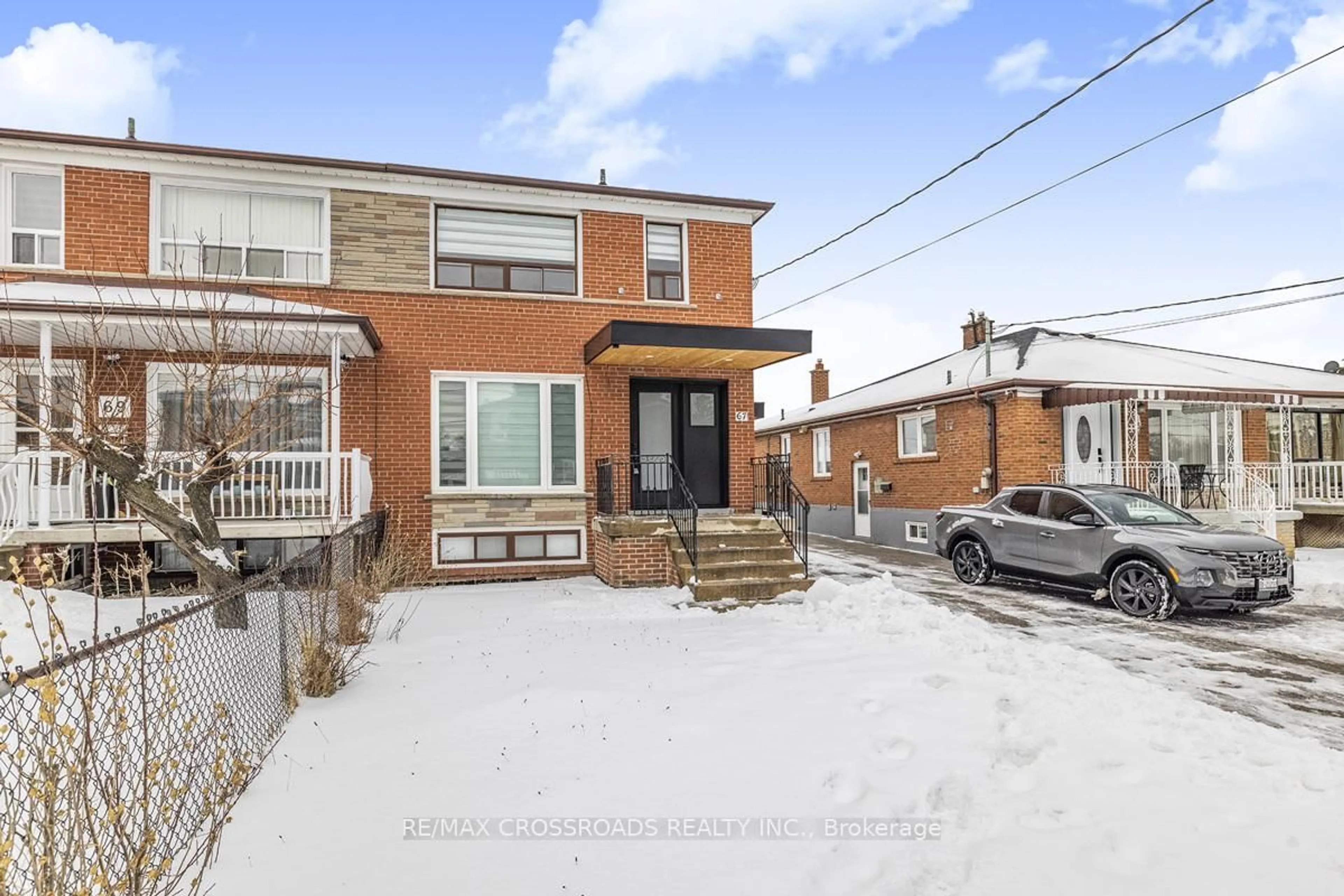 Home with brick exterior material, street for 67 Thurrock Rd, Toronto Ontario M3L 1P5