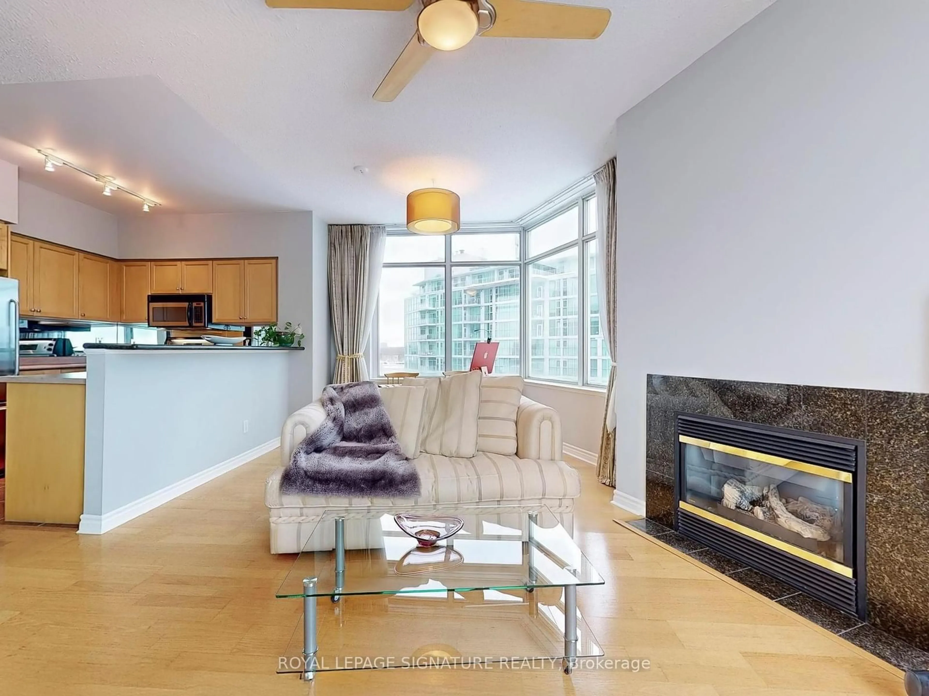 Living room with furniture, wood/laminate floor for 5 Marine Parade Dr #1014, Toronto Ontario M8V 4B4