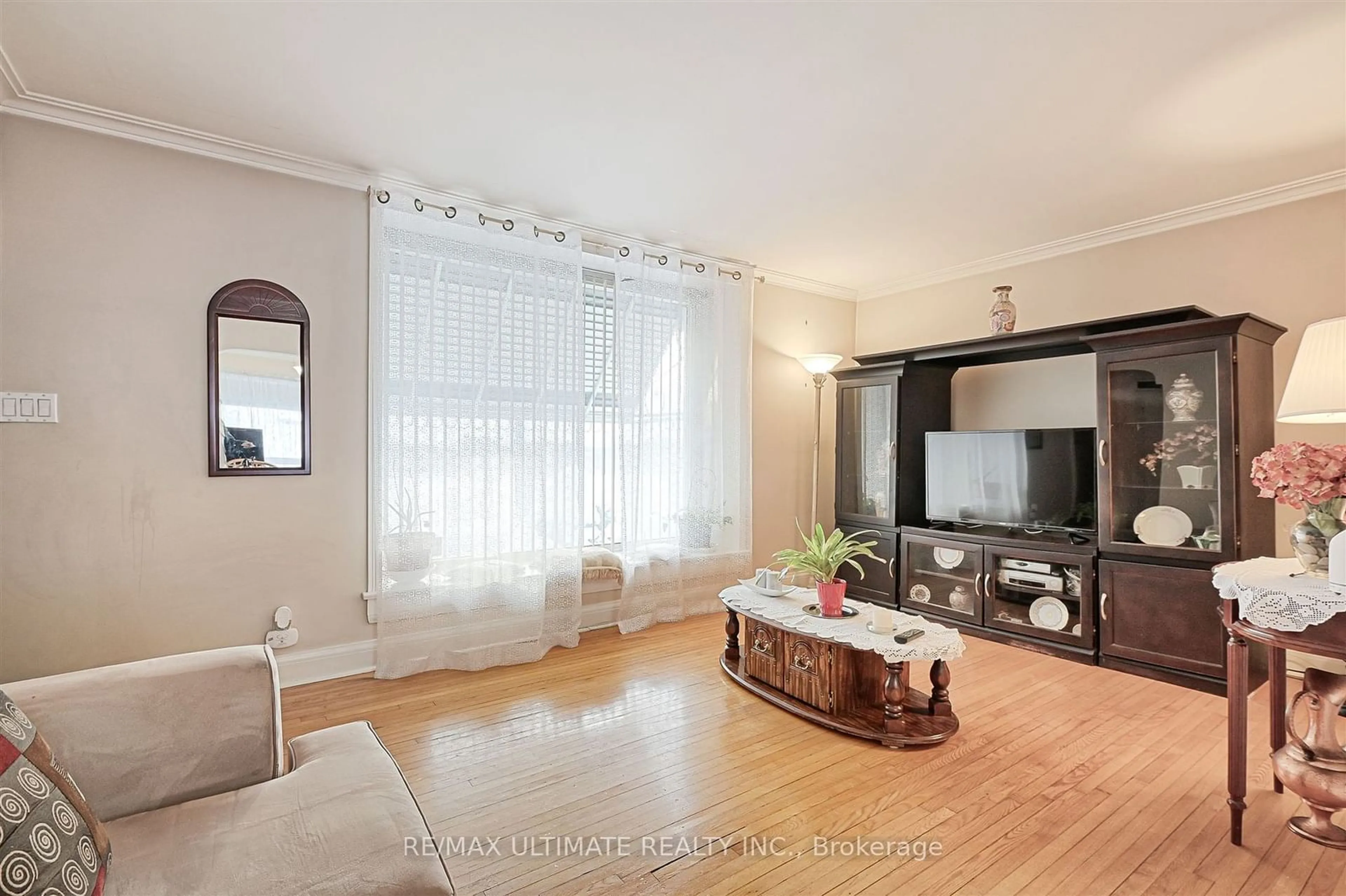 Living room with furniture, wood/laminate floor for 21 Trethewey Dr, Toronto Ontario M6M 4A9