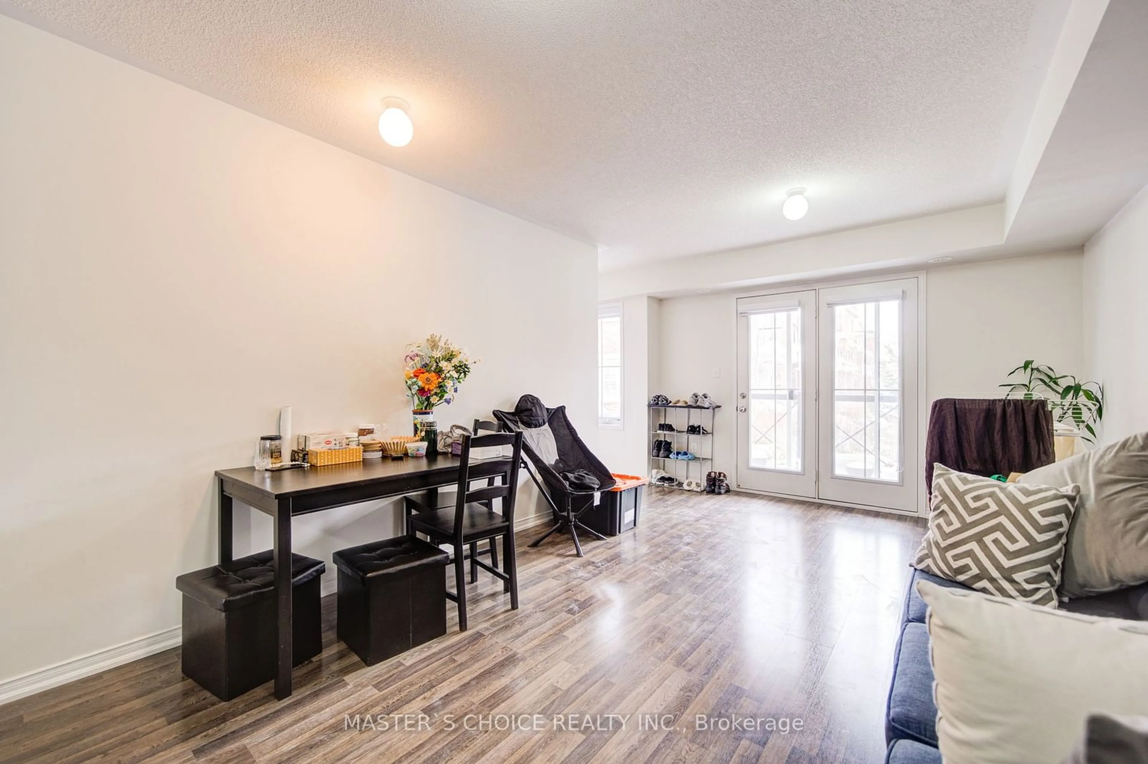 Living room with furniture, wood/laminate floor for 2500 Post Rd #14, Oakville Ontario L6H 0K1