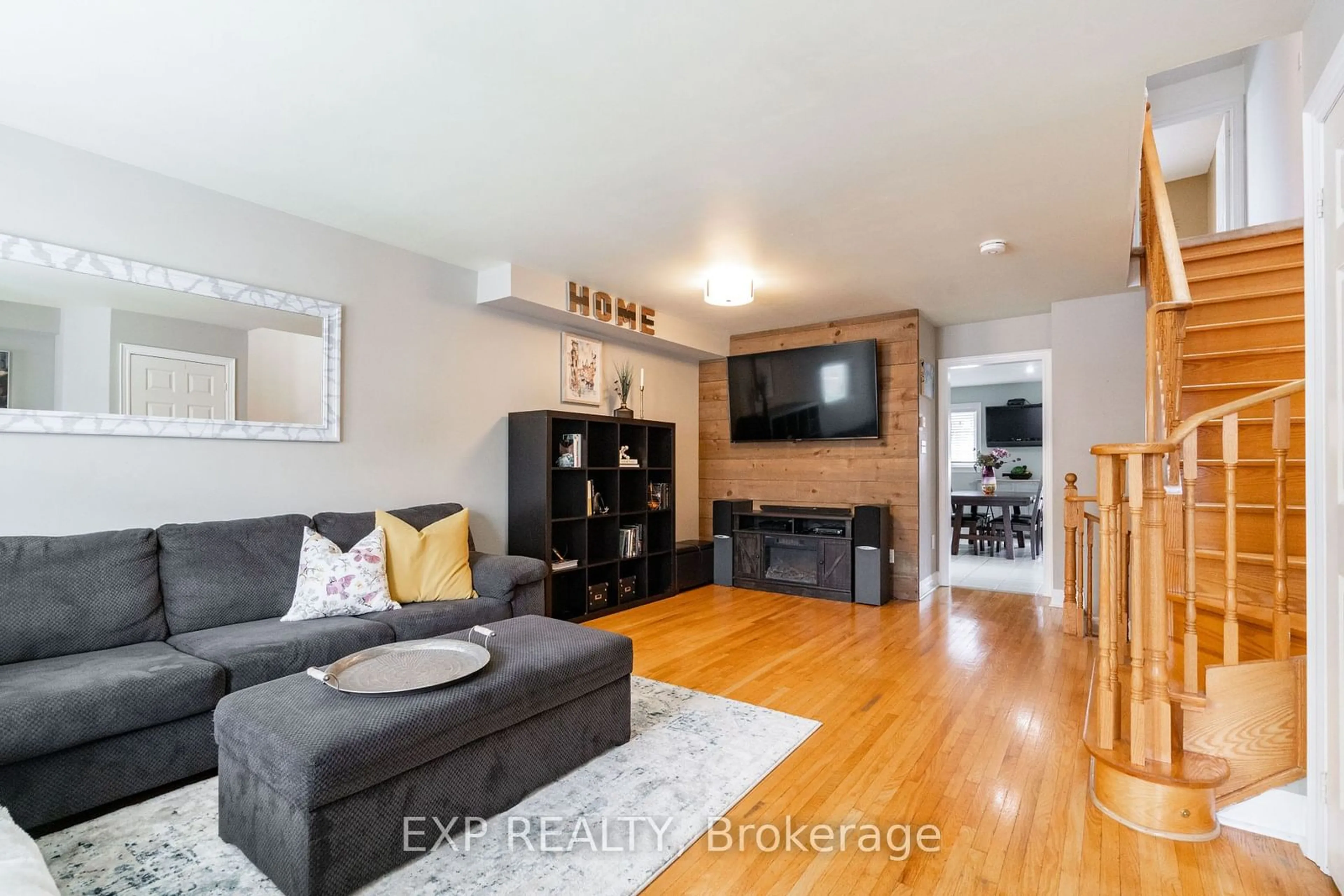 Living room with furniture, wood/laminate floor for 18 Estoril Terr, Toronto Ontario M6N 5E2