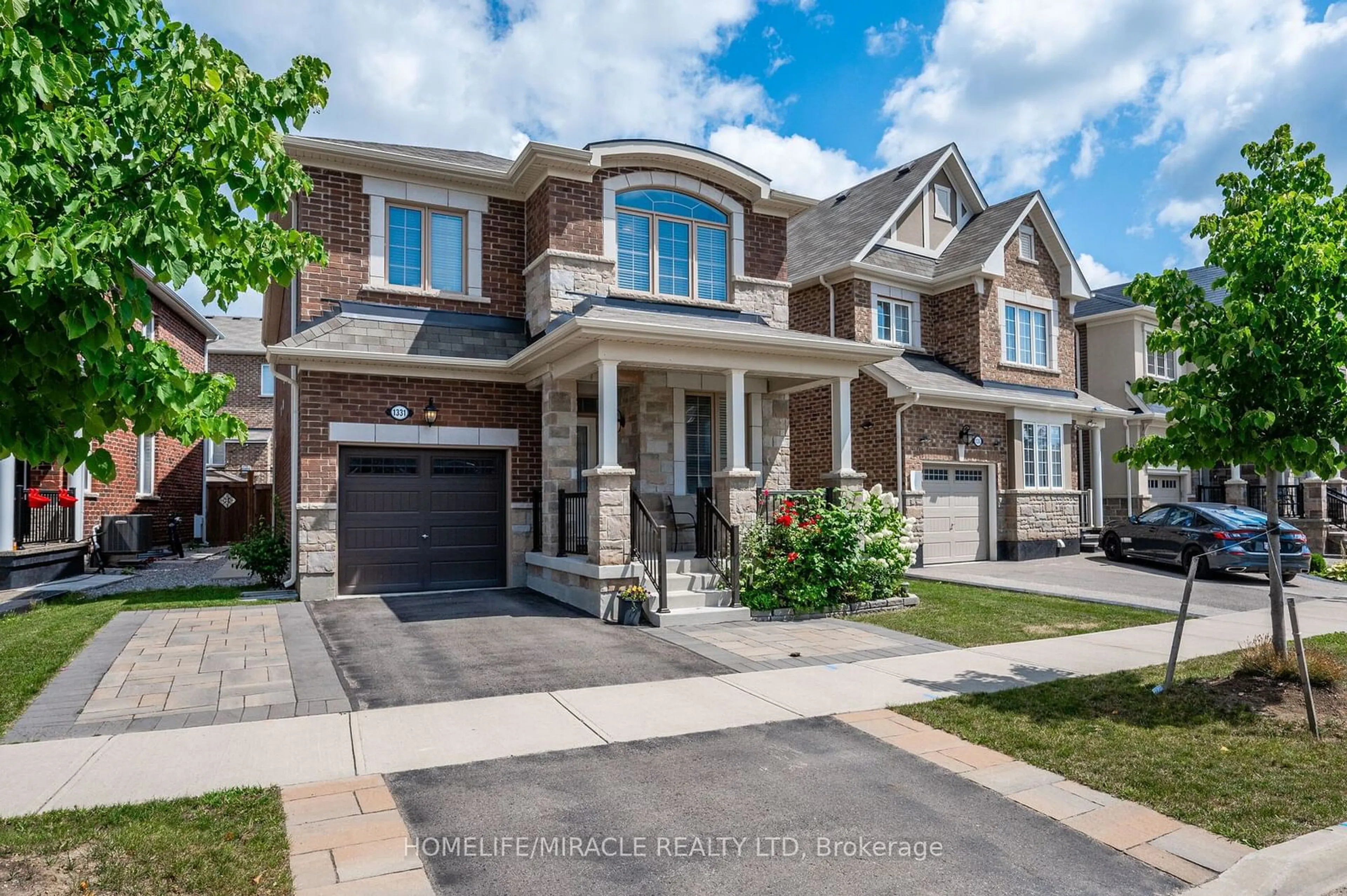 Home with brick exterior material, street for 1331 Rose Way, Milton Ontario L9E 1M3