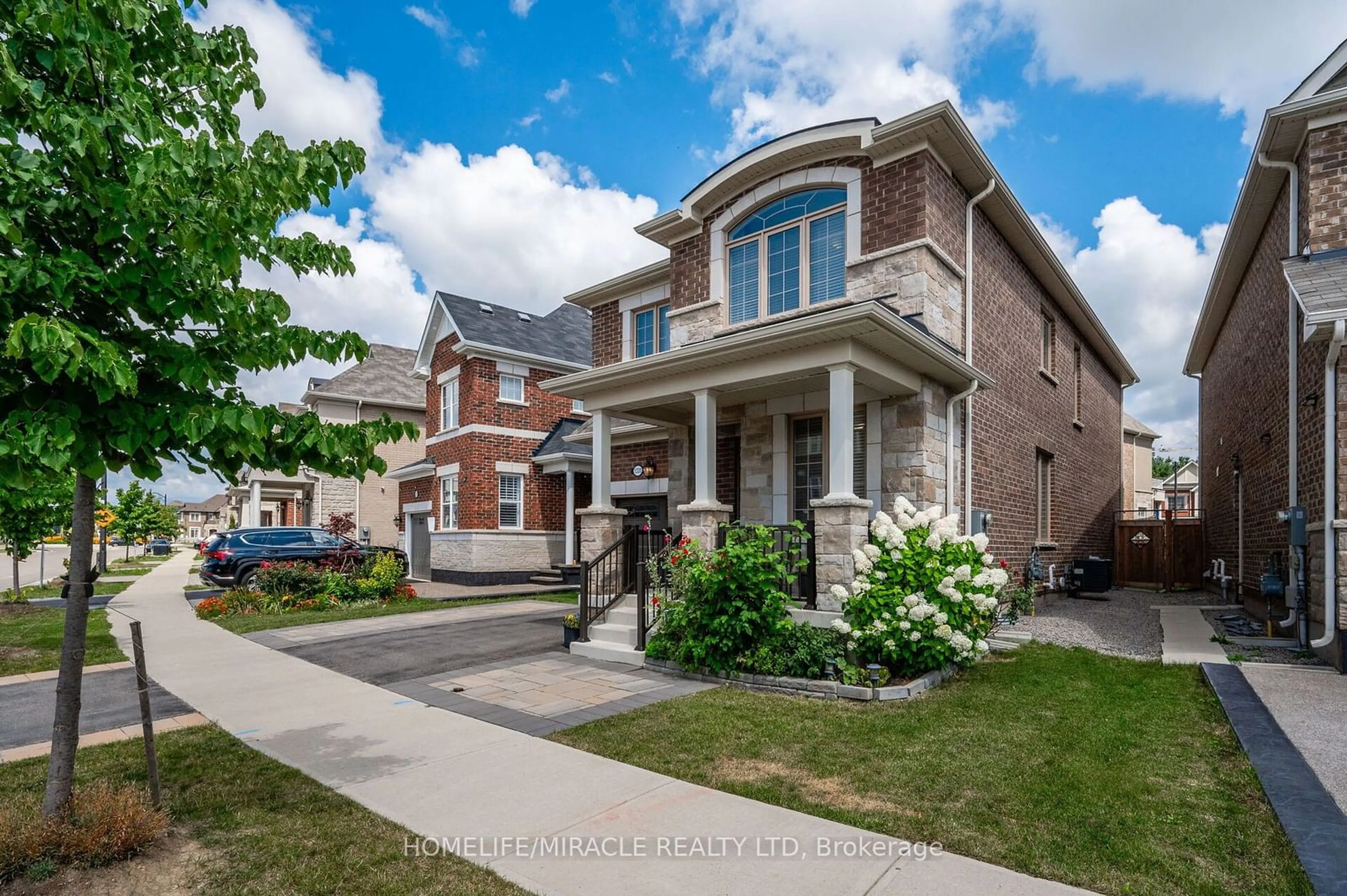 Home with brick exterior material, street for 1331 Rose Way, Milton Ontario L9E 1M3