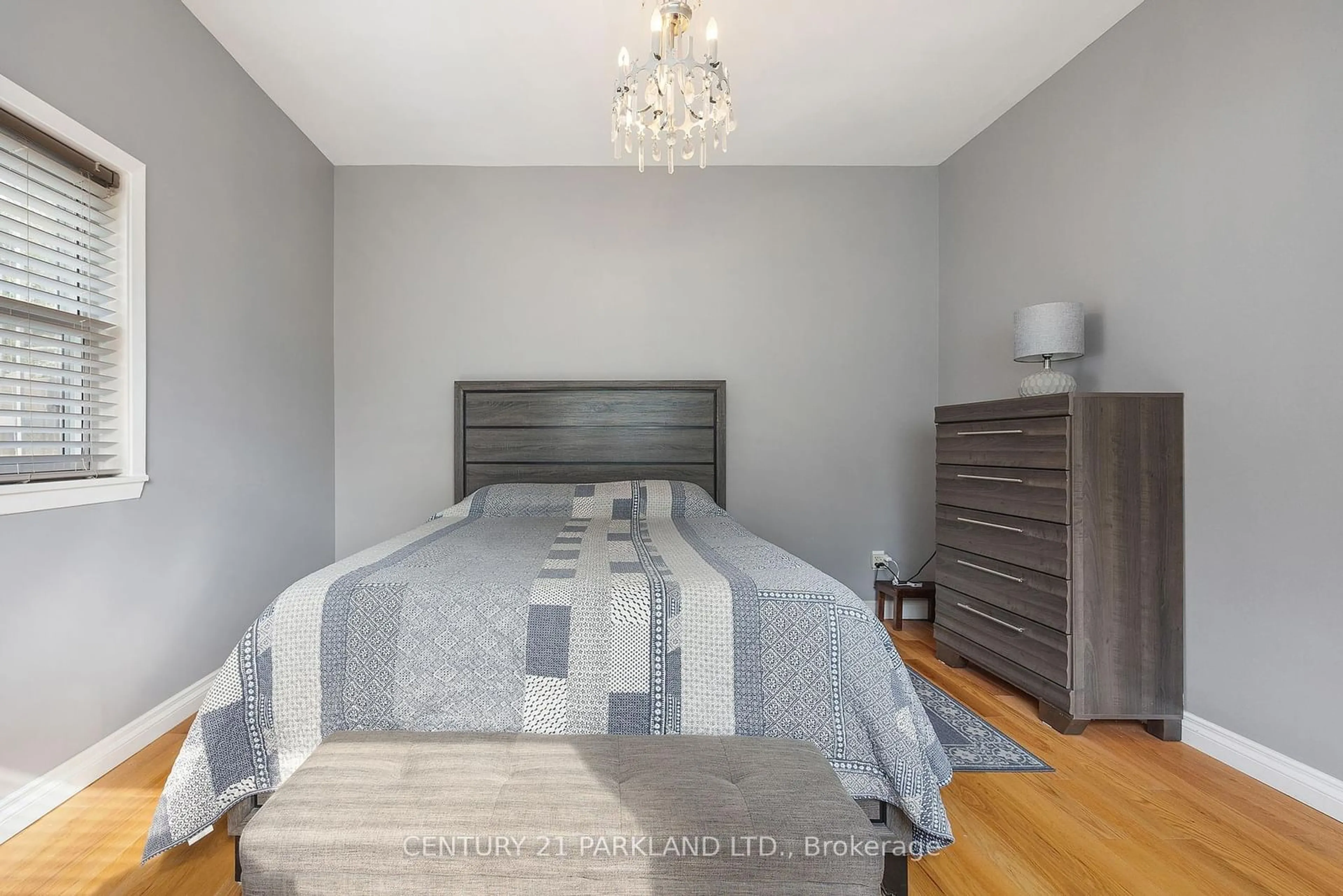 Bedroom with bed, wood/laminate floor for 114 Rosemount Ave, Toronto Ontario M6H 3H2