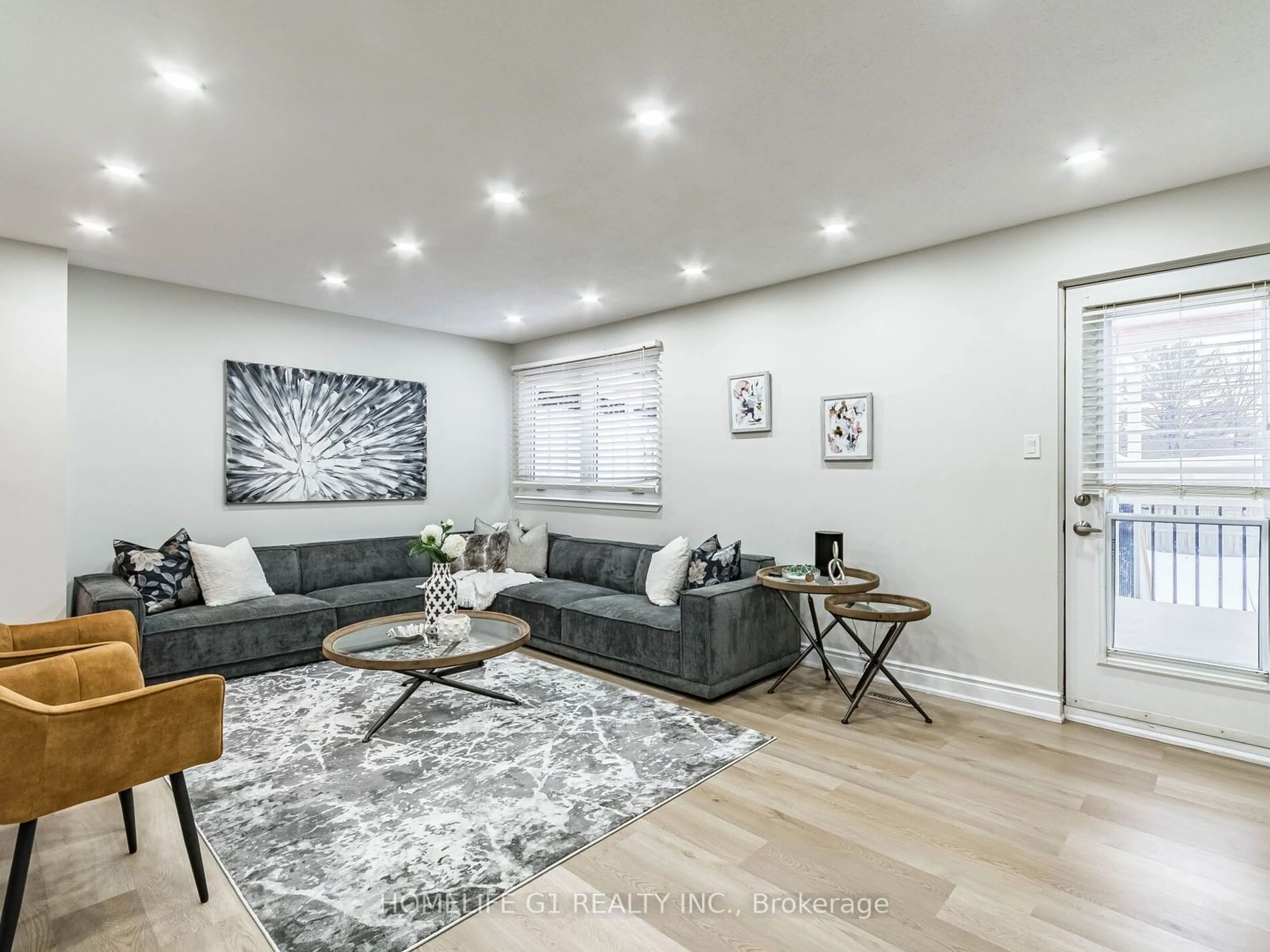 Living room with furniture, wood/laminate floor for 5510 Schueller Cres, Burlington Ontario L7L 3T2