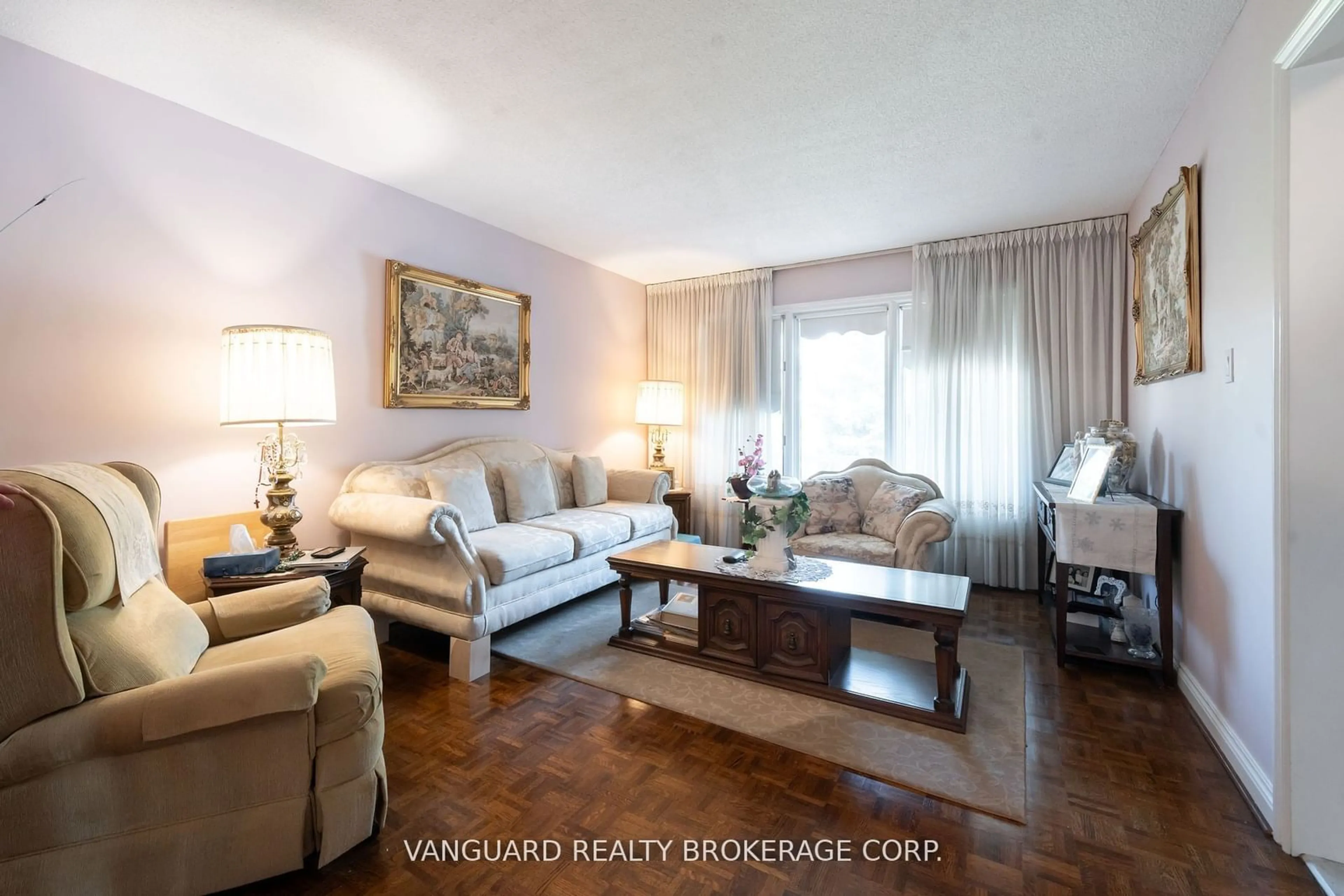 Living room with furniture, wood/laminate floor for 5 Norris Pl, Toronto Ontario M9M 1K6