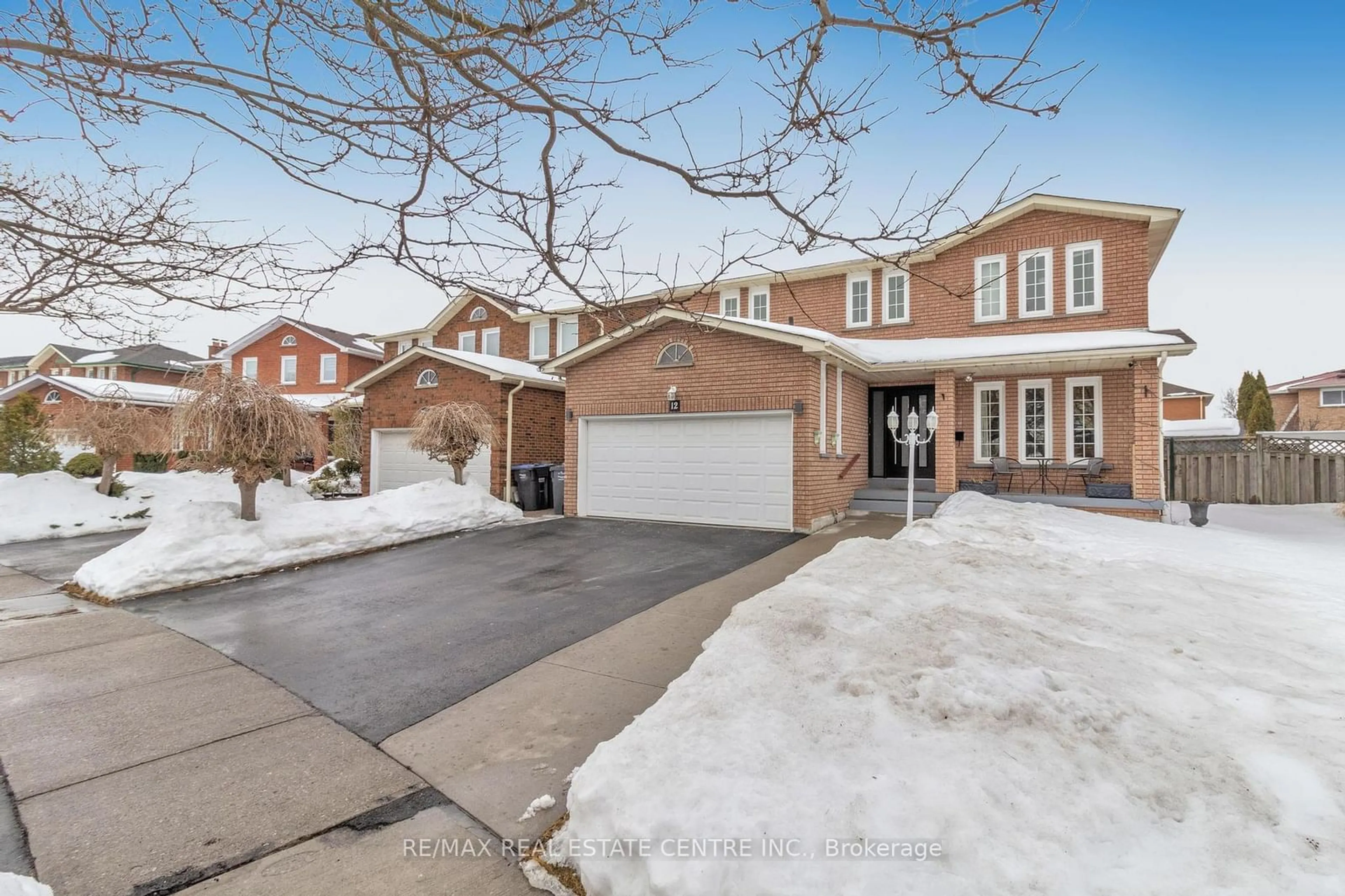 Home with brick exterior material, street for 12 Sugar Creek Lane, Brampton Ontario L6W 3X6