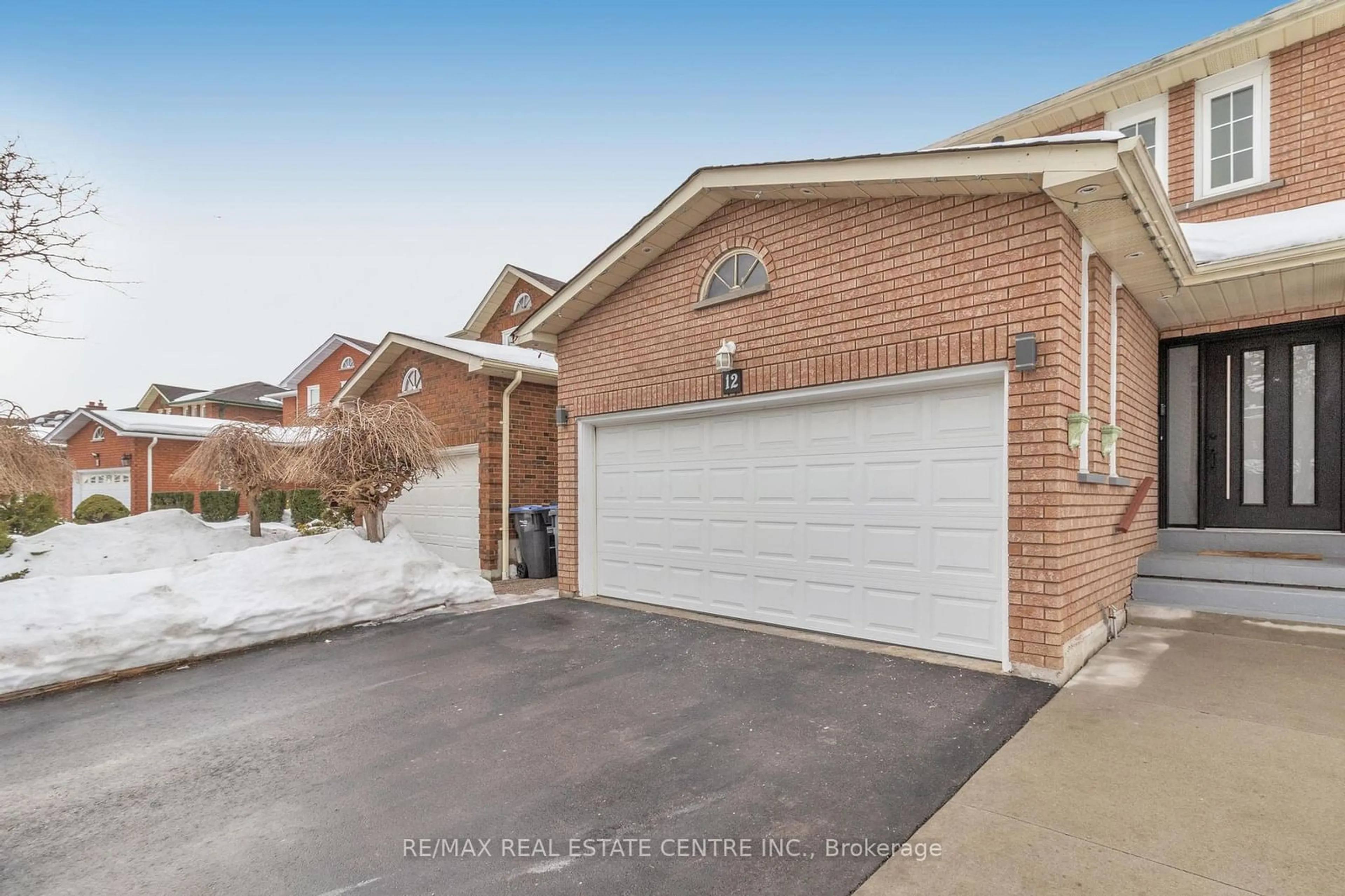 Home with brick exterior material, street for 12 Sugar Creek Lane, Brampton Ontario L6W 3X6