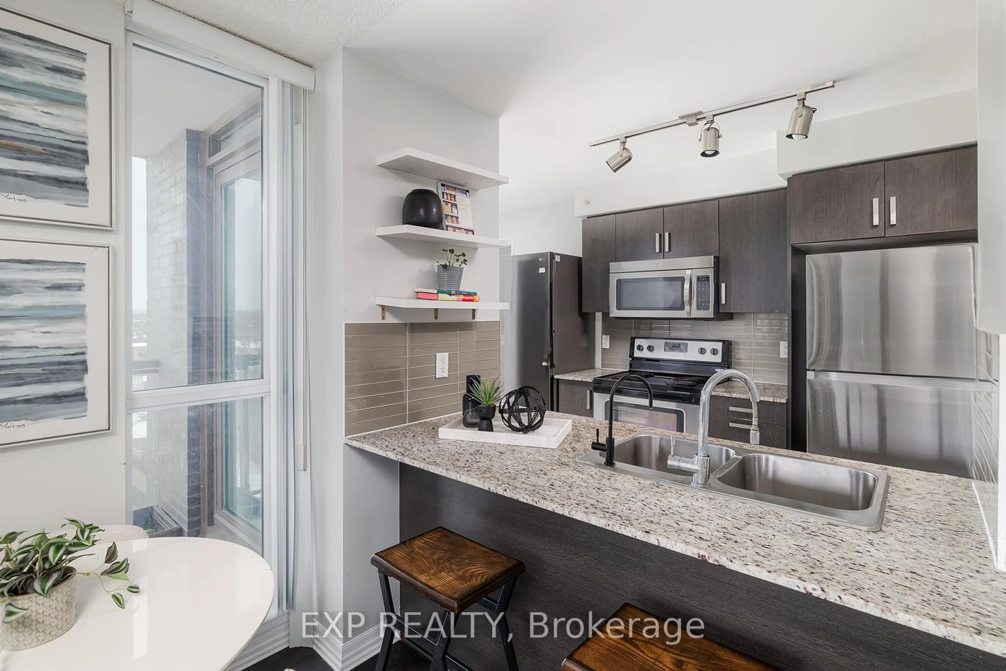 Open concept kitchen, ceramic/tile floor for 80 Esther Lorrie Dr #712, Toronto Ontario M9W 0C6