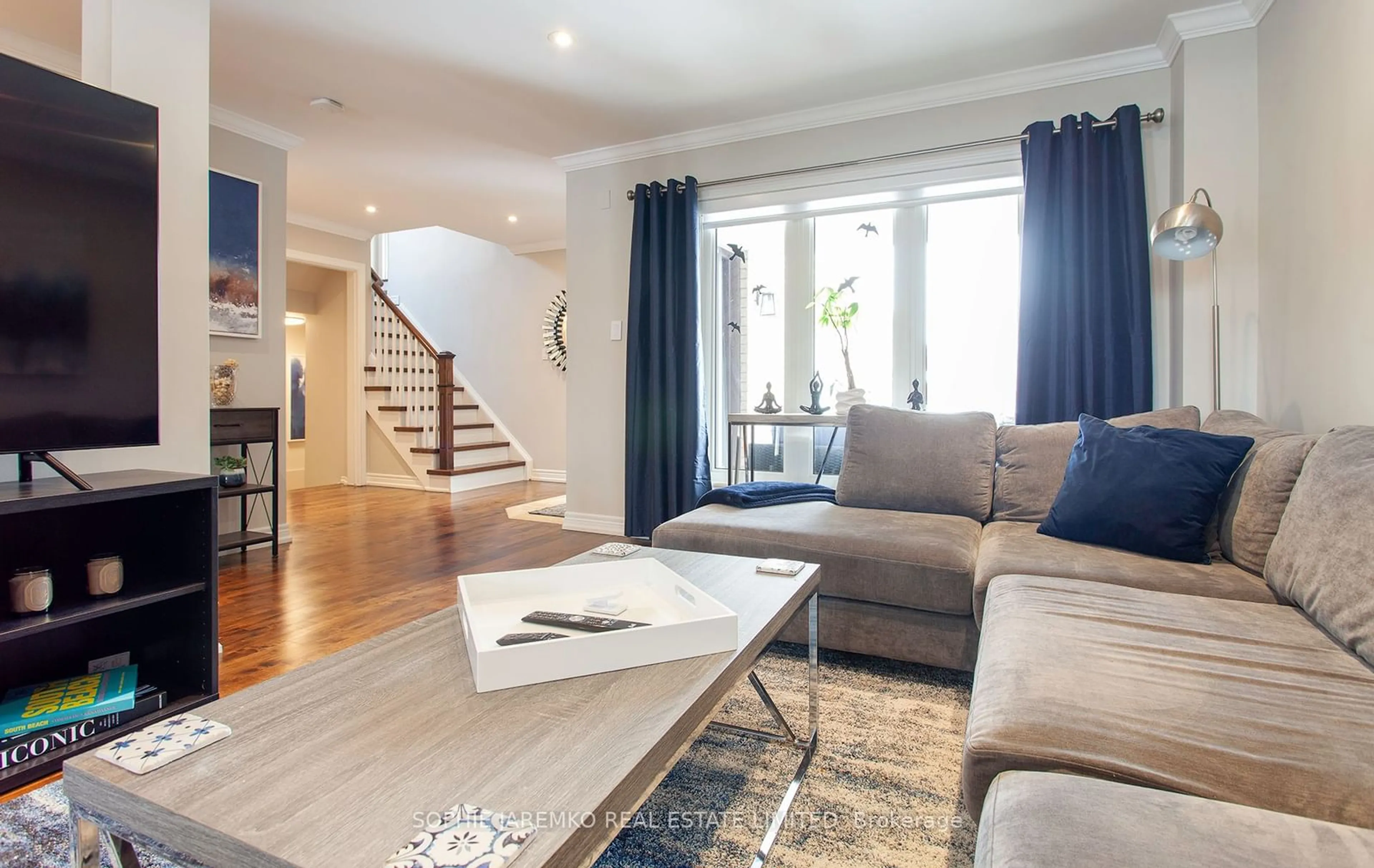 Living room with furniture, wood/laminate floor for 2103 Grand Ravine Dr, Oakville Ontario L6H 6B4