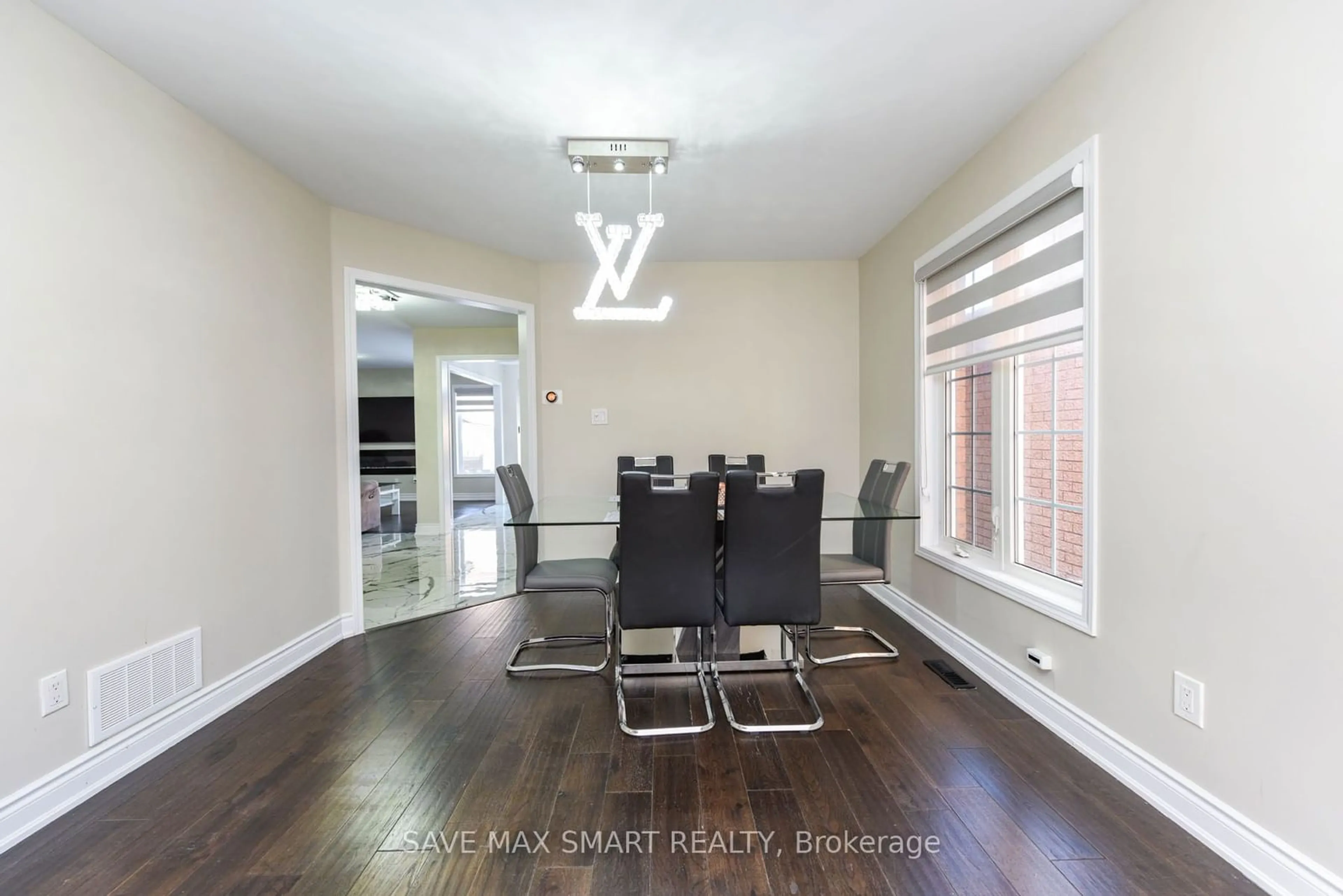 Dining room, wood/laminate floor for 54 Beresford Cres, Brampton Ontario L6P 2M1