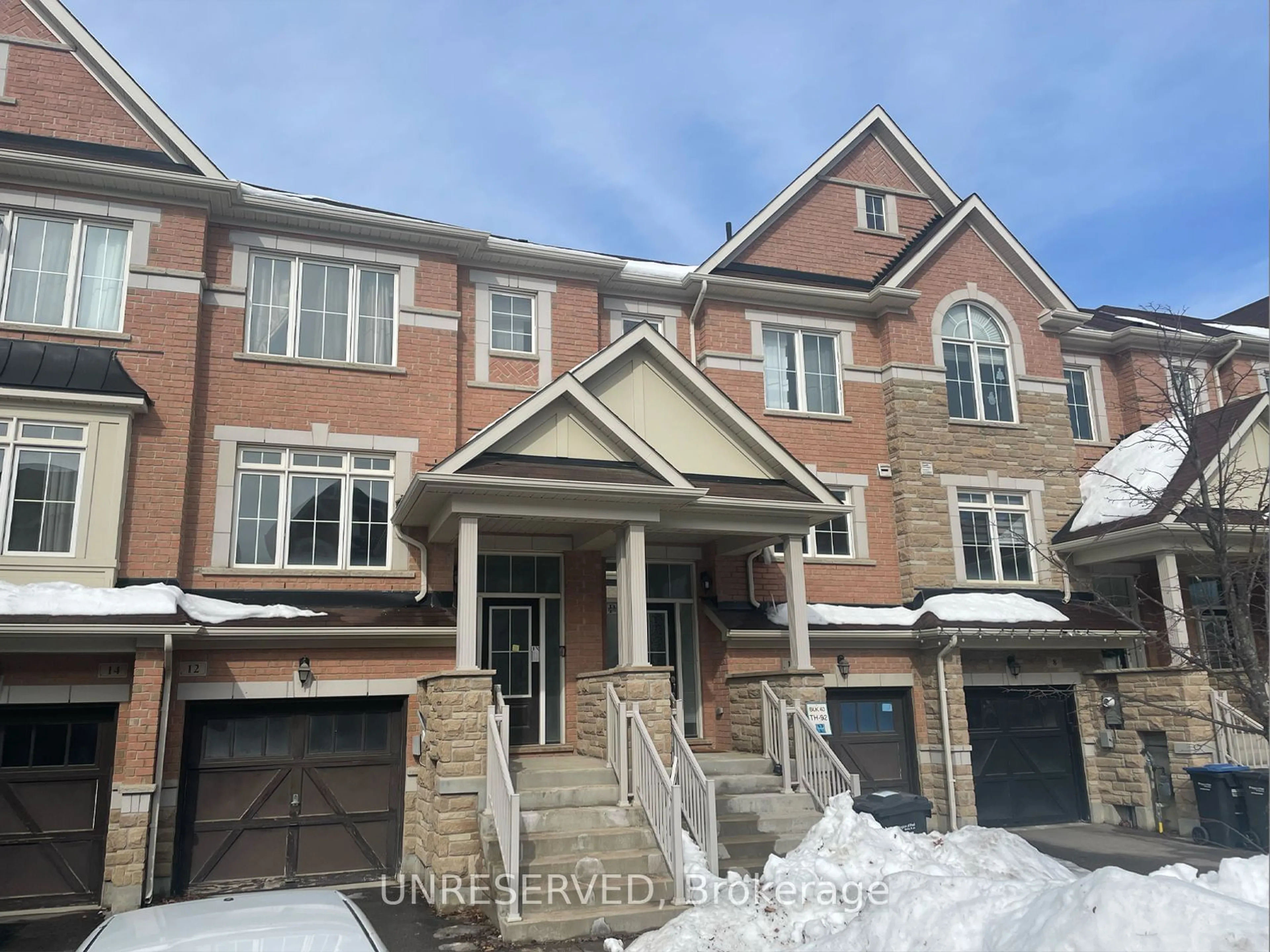 Home with brick exterior material, street for 12 Rockbrook Tr, Brampton Ontario L7A 4H8