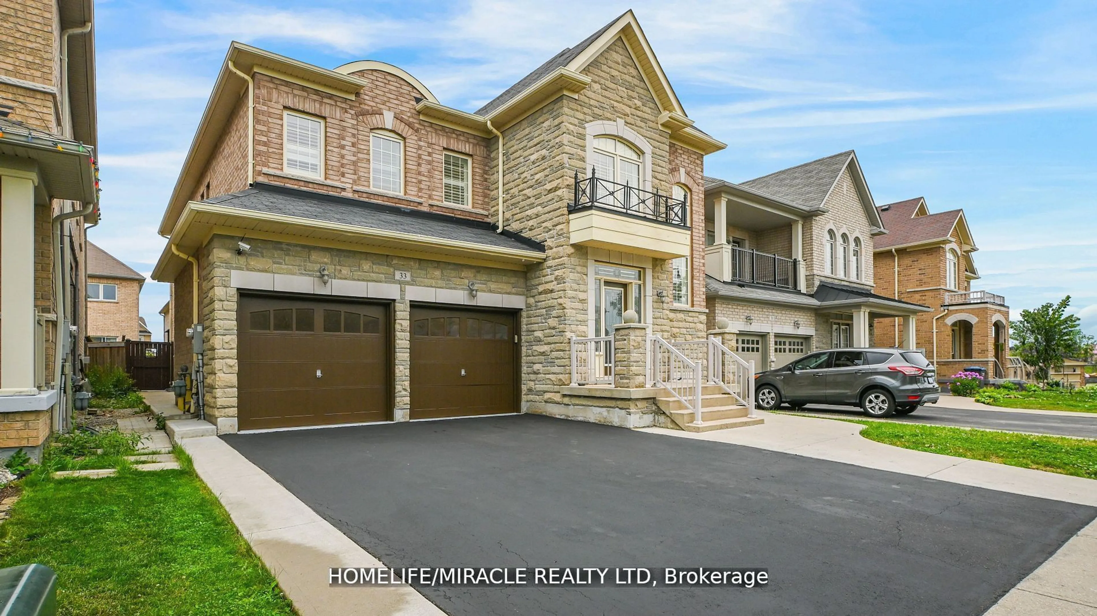 Home with brick exterior material, street for 33 Orangeblossom Tr, Brampton Ontario L6X 3B5