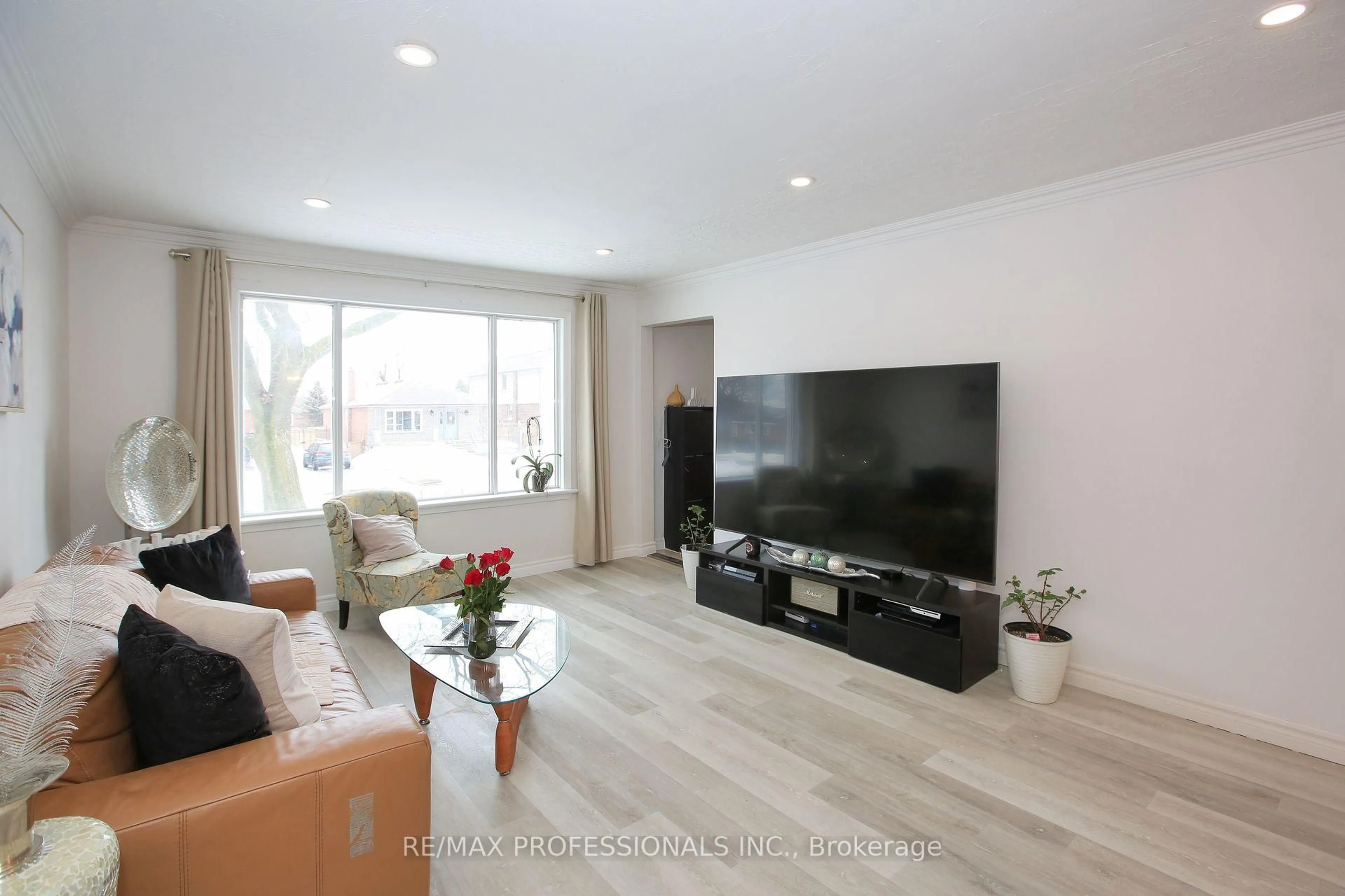 Living room with furniture, wood/laminate floor for 96 Nordin Ave, Toronto Ontario M8Z 2B3