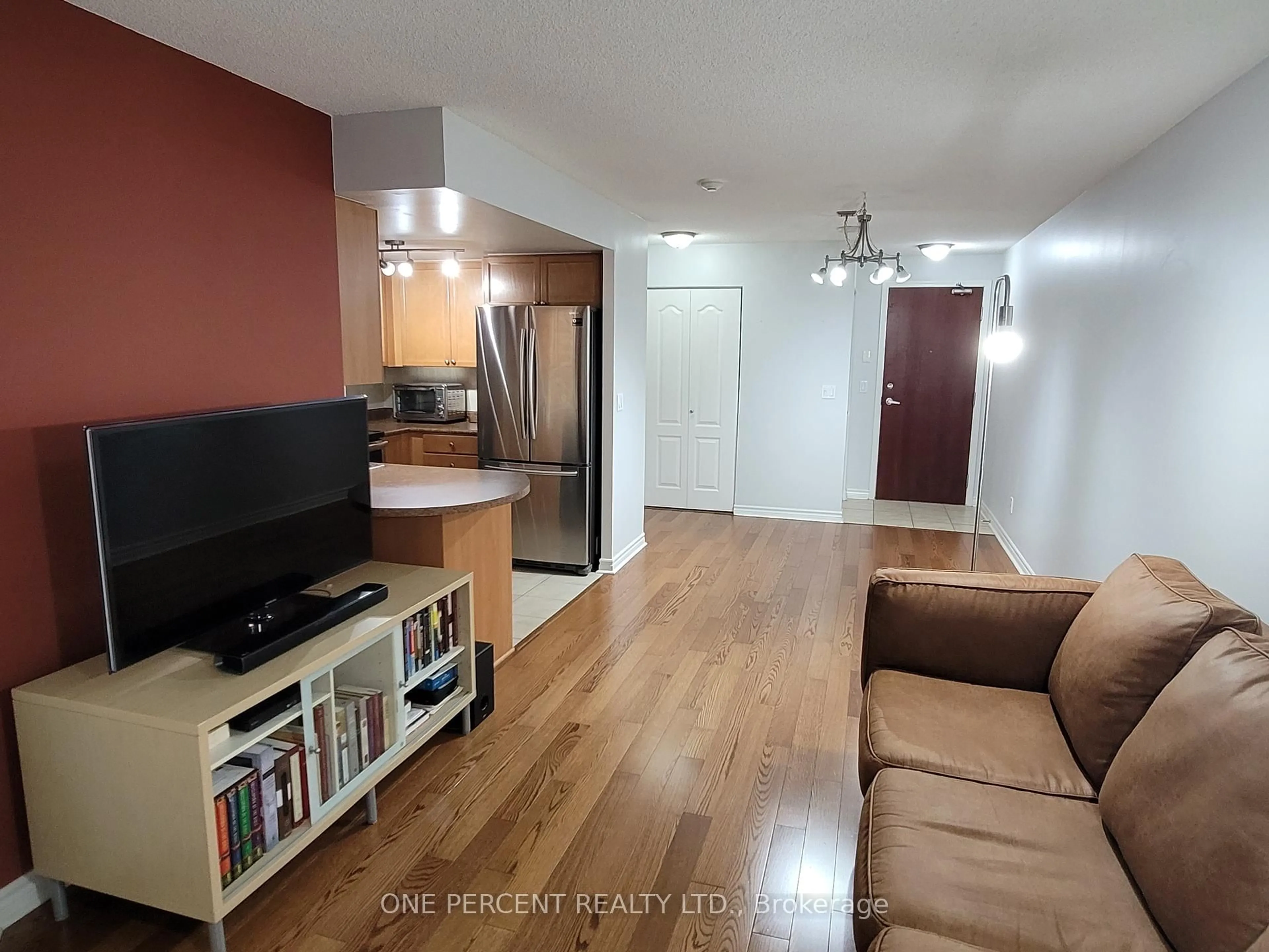 Living room with furniture, wood/laminate floor for 4080 Living Arts Dr #506, Mississauga Ontario L5B 4N3