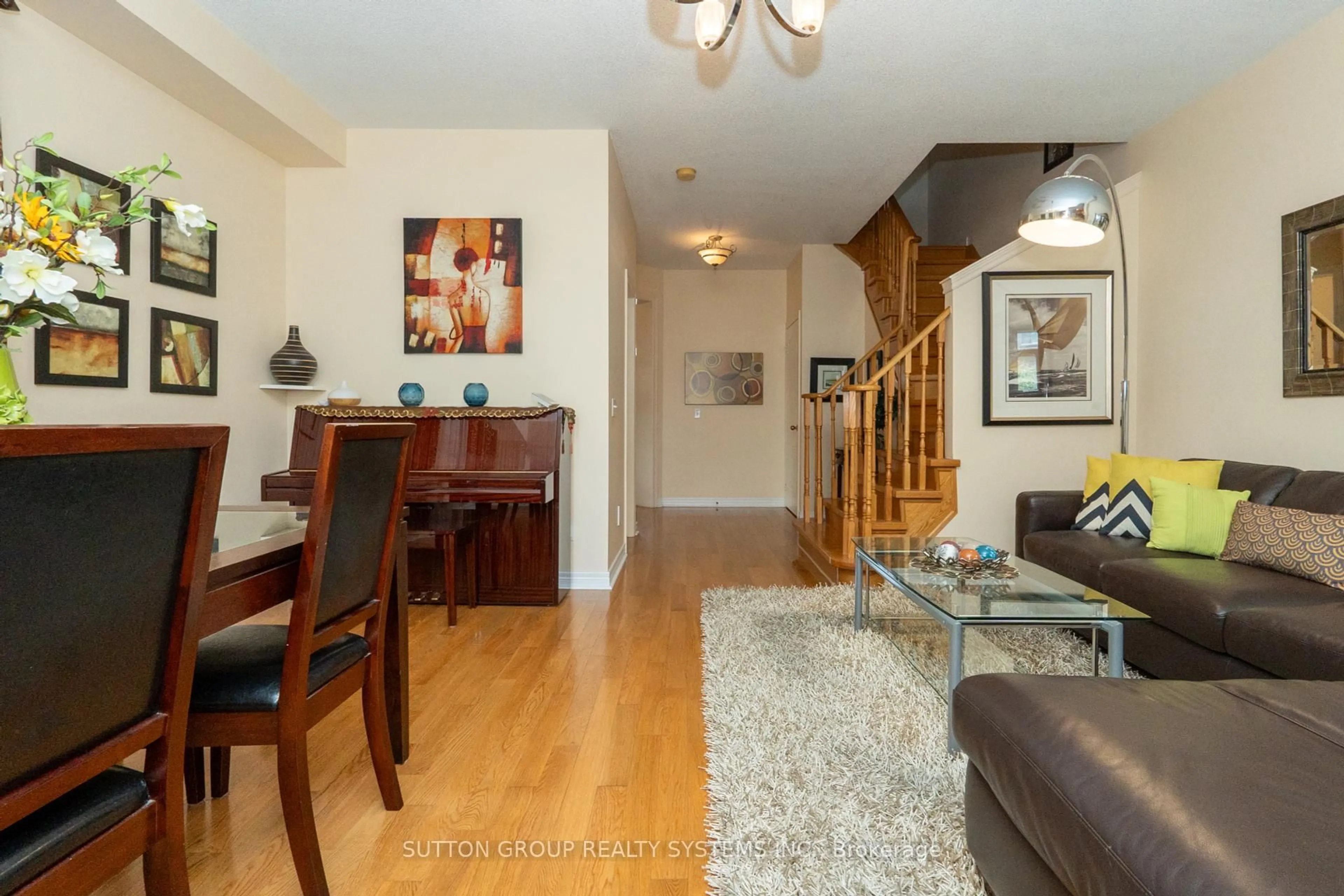 Living room with furniture, wood/laminate floor for 5636 Raleigh St, Mississauga Ontario L5M 7E4