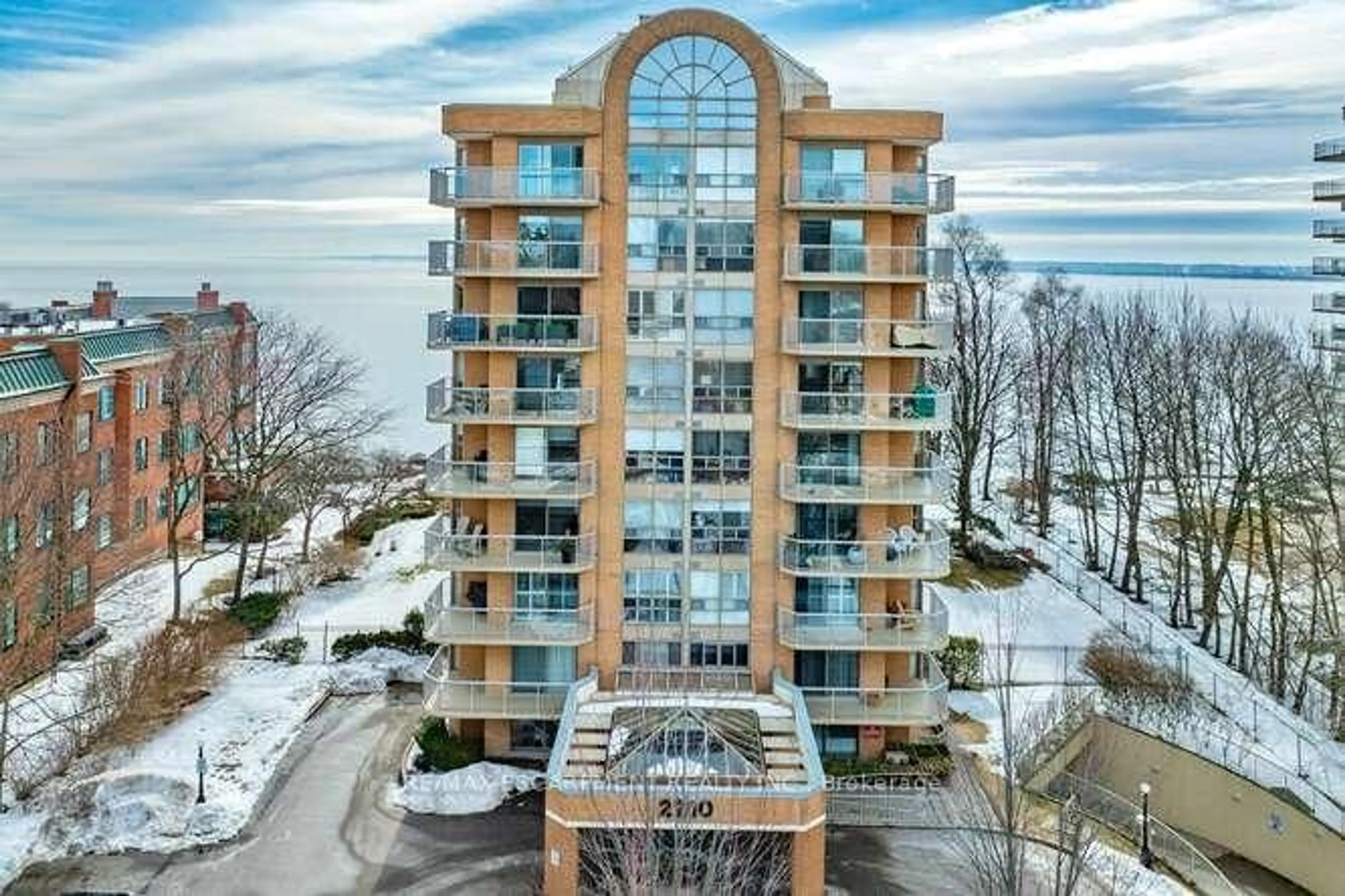 A pic from outside/outdoor area/front of a property/back of a property/a pic from drone, water/lake/river/ocean view for 2210 Lakeshore Rd #504, Burlington Ontario L7R 4J9