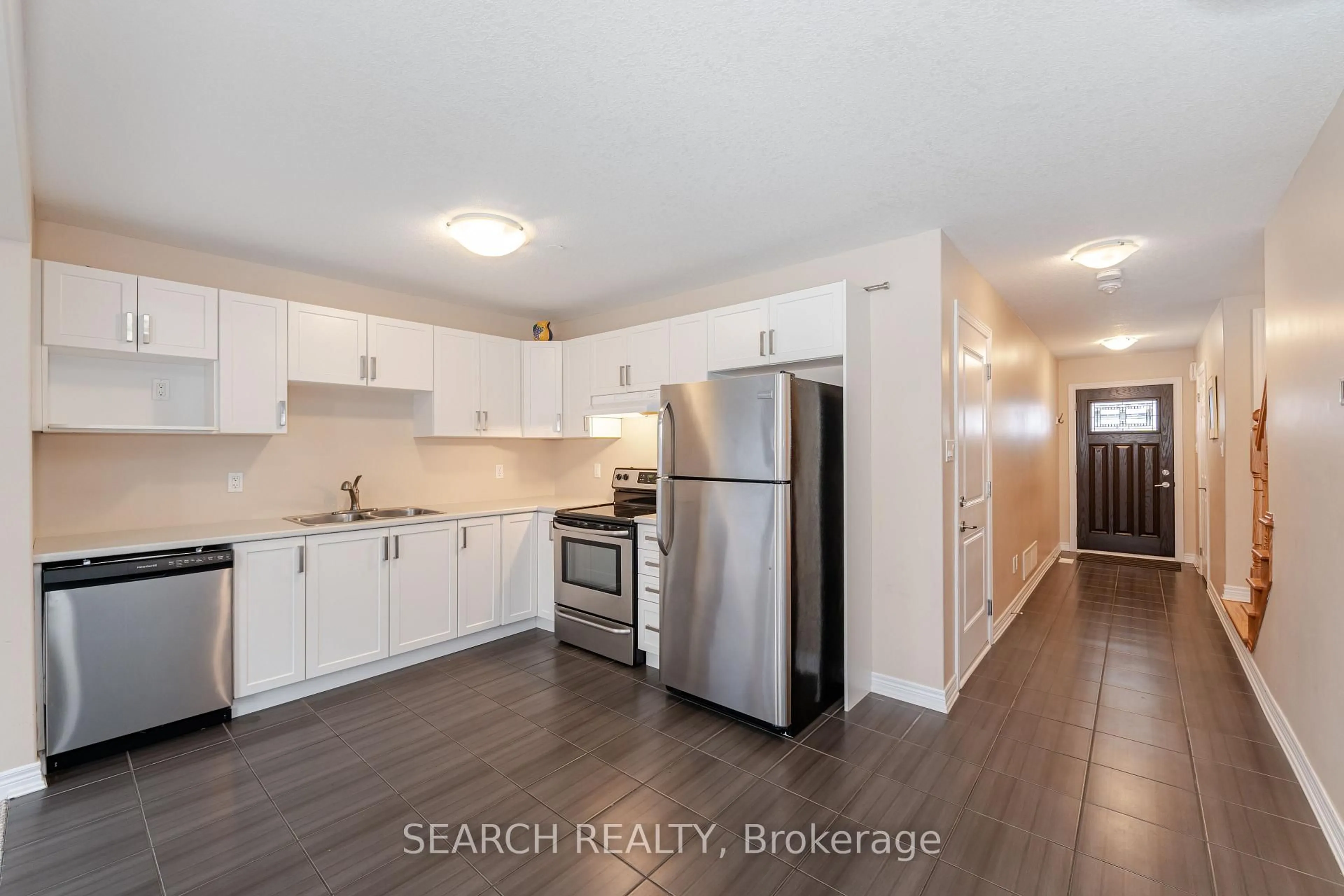 Open concept kitchen, wood/laminate floor for 124 Parkinson Cres #16, Orangeville Ontario L9W 6X3