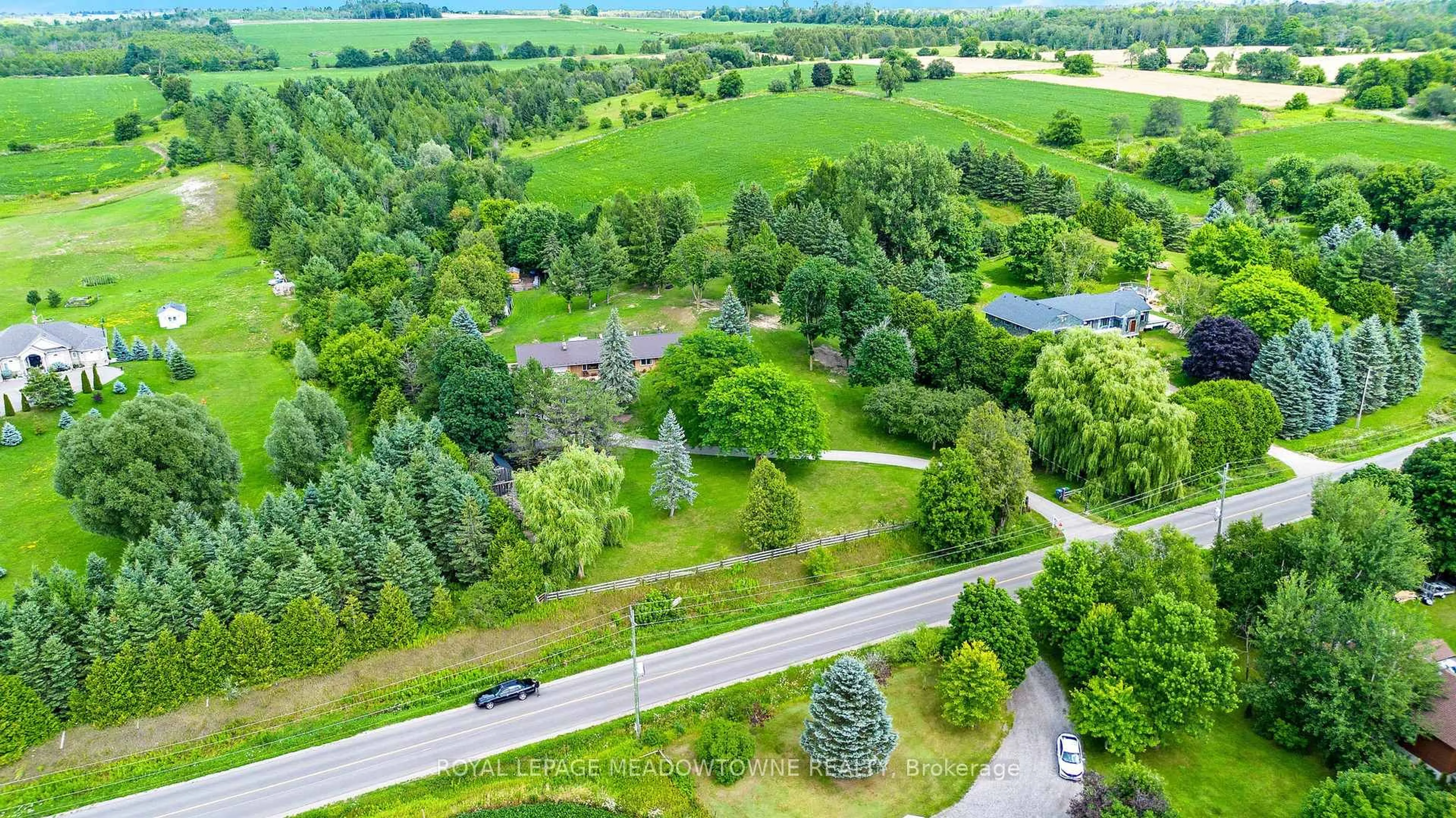 A pic from outside/outdoor area/front of a property/back of a property/a pic from drone, forest/trees view for 19997 Willoughby Rd, Caledon Ontario L7K 1W1