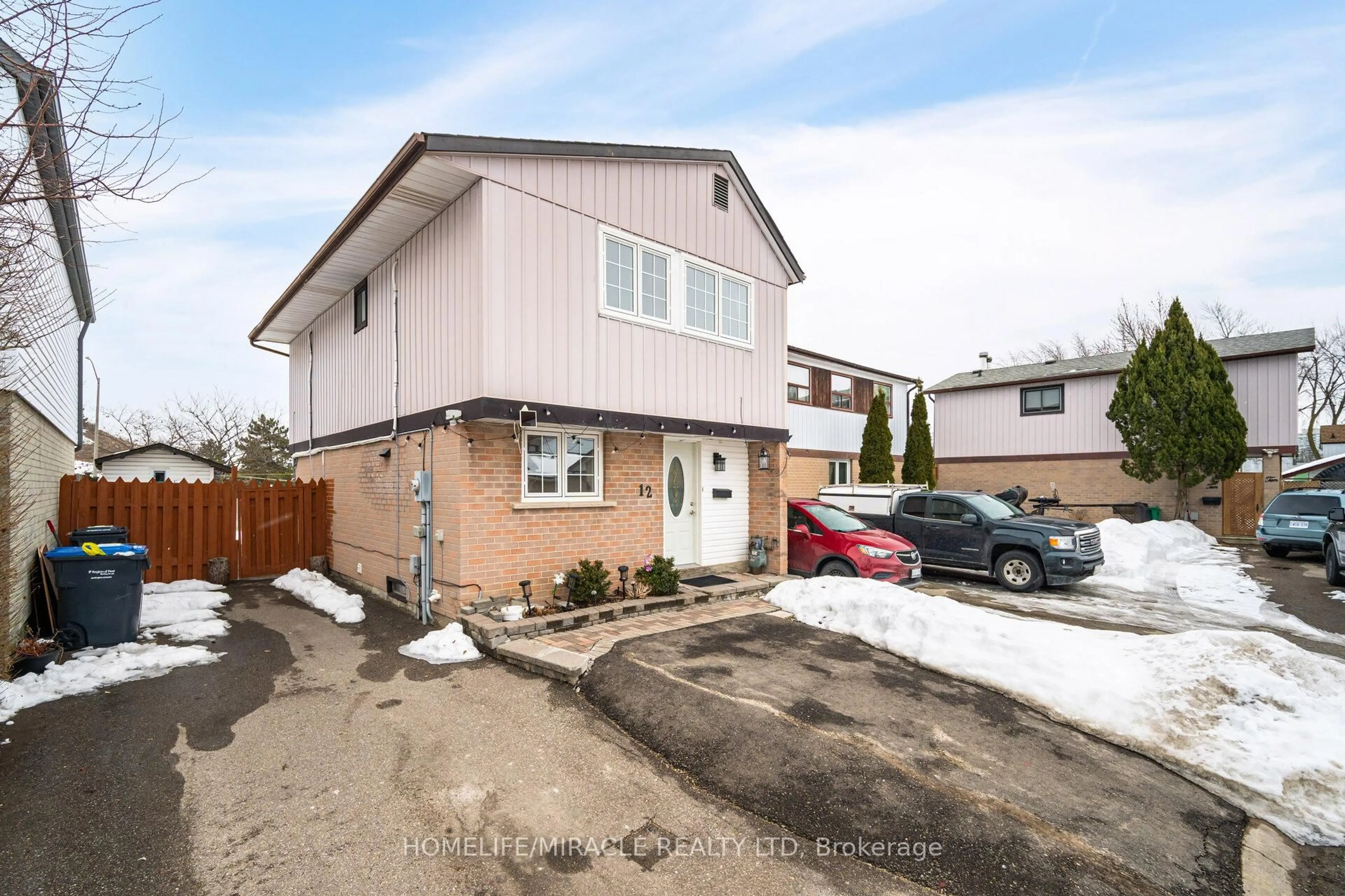 A pic from outside/outdoor area/front of a property/back of a property/a pic from drone, street for 12 Huckleberry Sq, Brampton Ontario L6S 1Y2