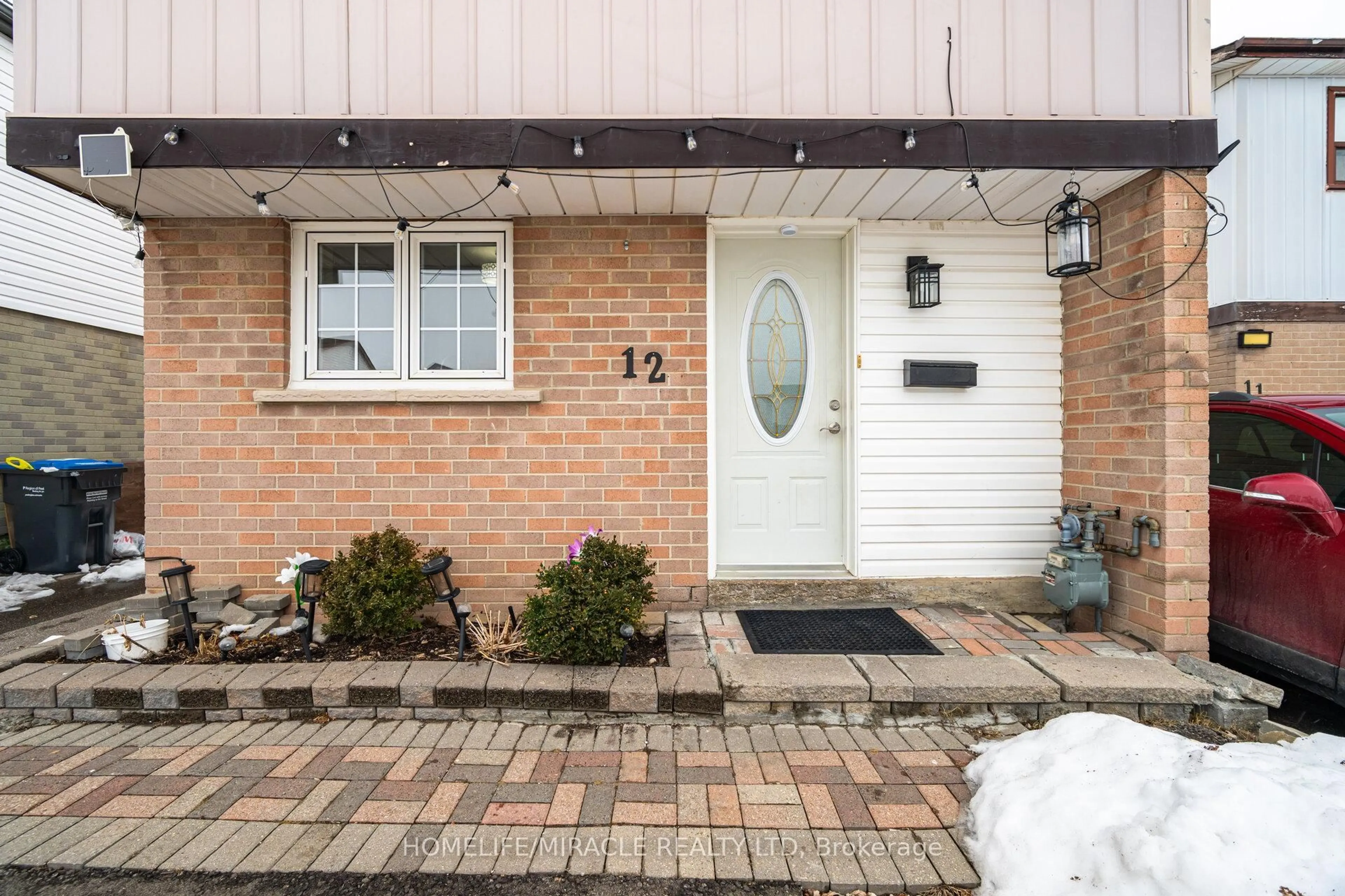 Home with brick exterior material, street for 12 Huckleberry Sq, Brampton Ontario L6S 1Y2