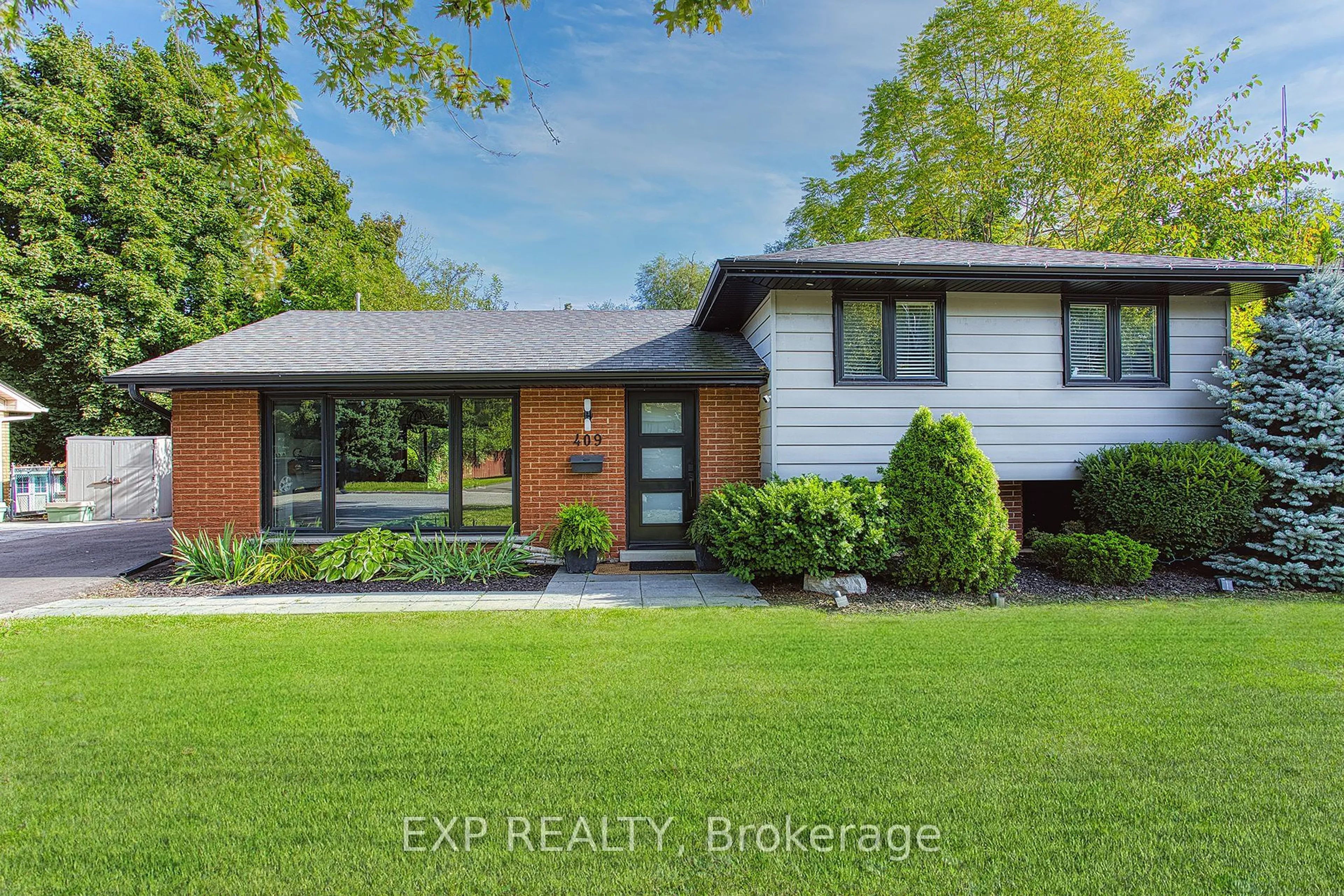 Home with brick exterior material, street for 409 Erindale Dr, Burlington Ontario L7L 4T3