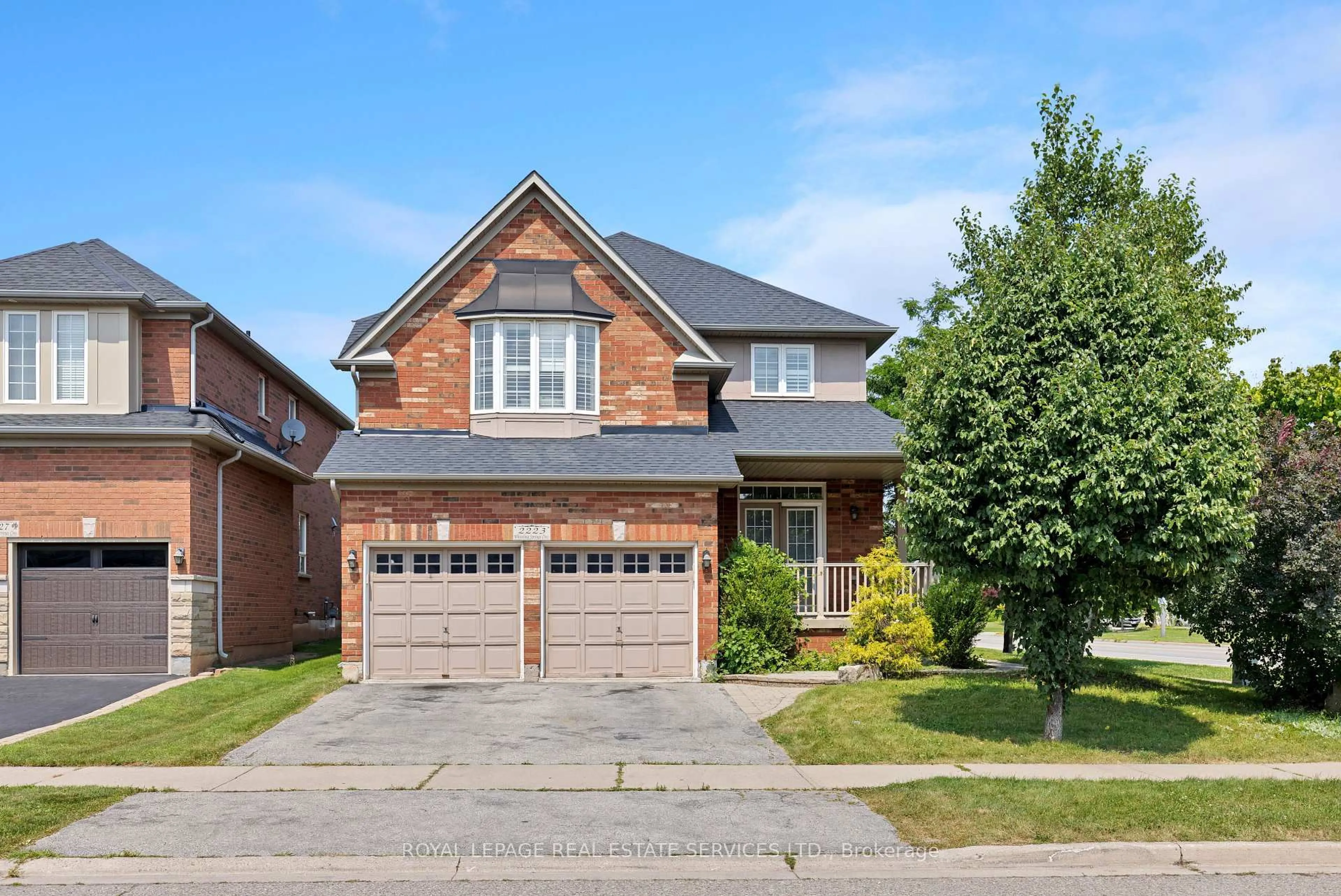 Home with brick exterior material, street for 2223 Whistling Springs Cres, Oakville Ontario L6M 5G5