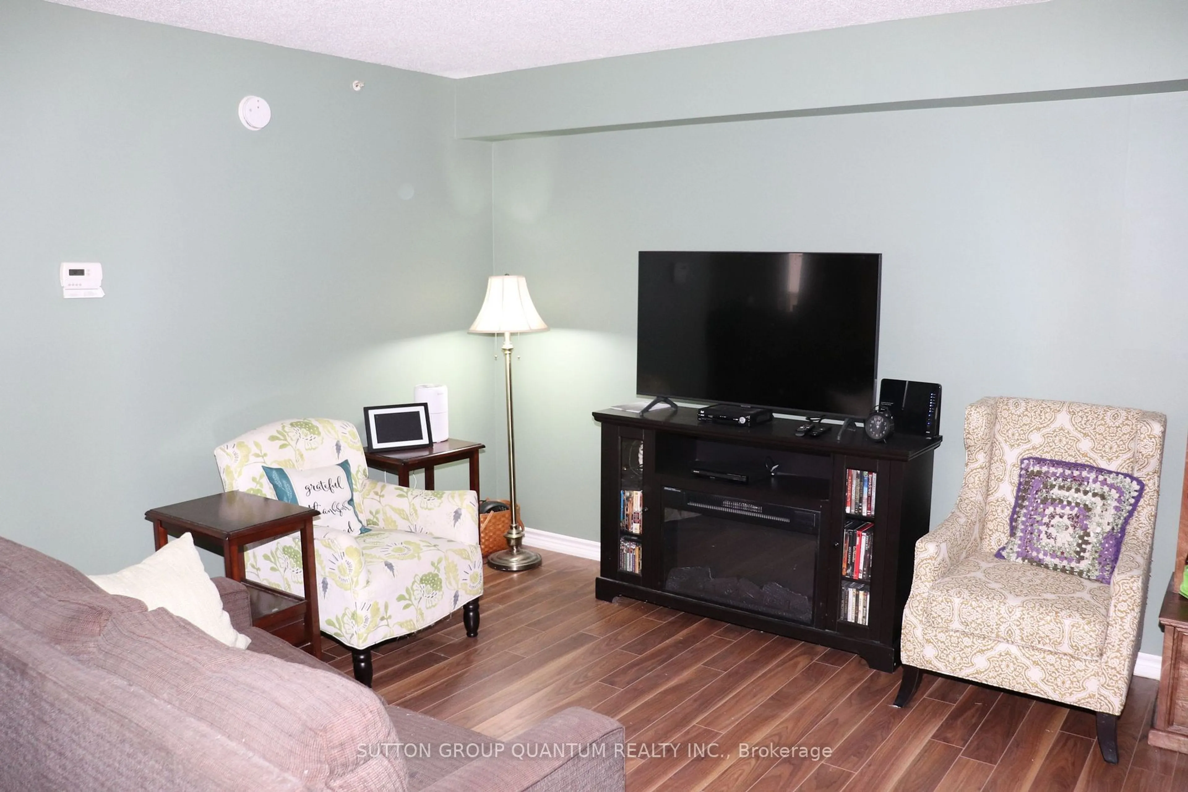 Living room with furniture, wood/laminate floor for 4025 Kilmer Dr #301, Burlington Ontario L7M 4M5