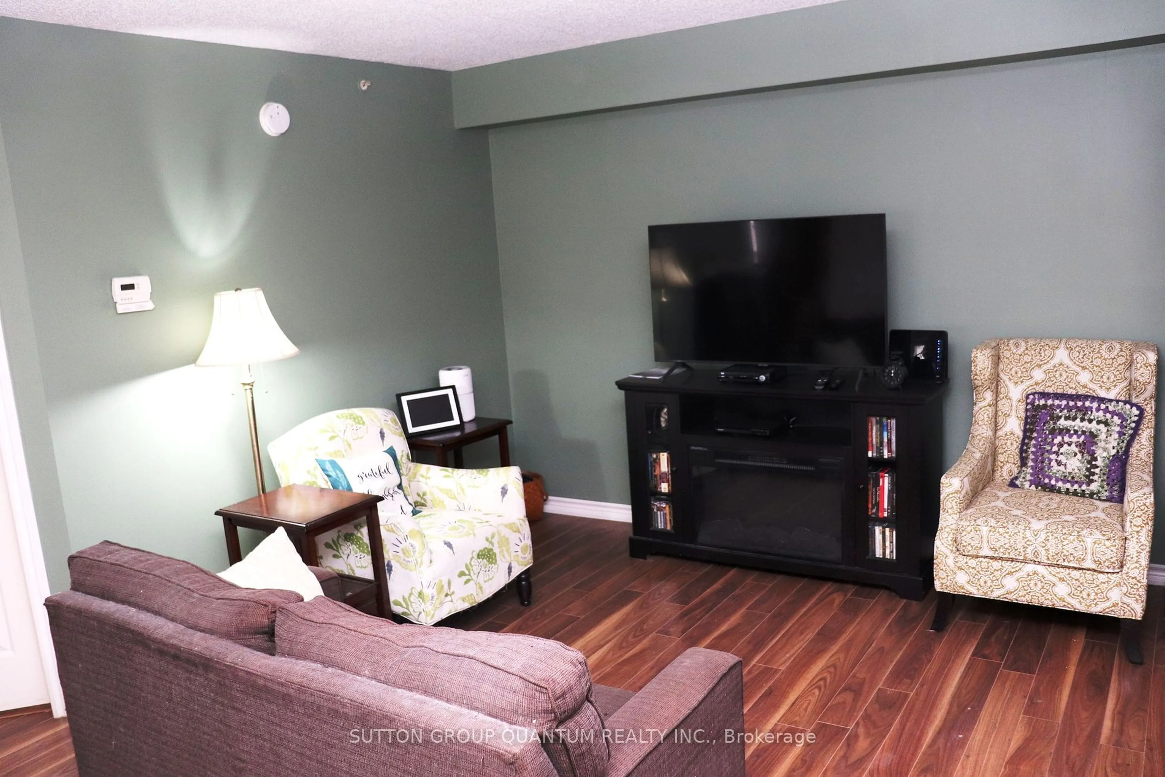 Living room with furniture, wood/laminate floor for 4025 Kilmer Dr #301, Burlington Ontario L7M 4M5