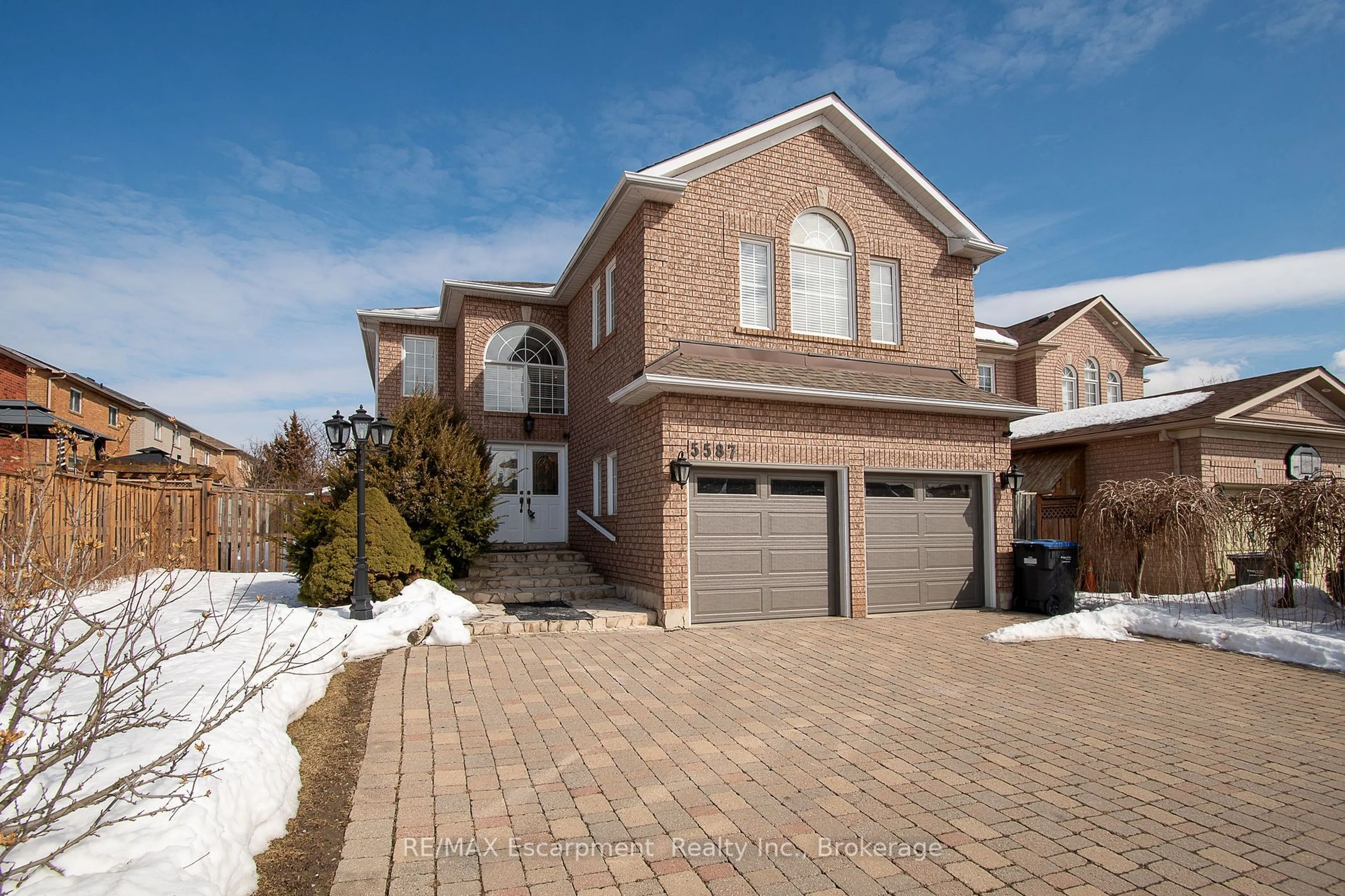 Home with brick exterior material, street for 5587 Whimbrel Rd, Mississauga Ontario L5V 2J4